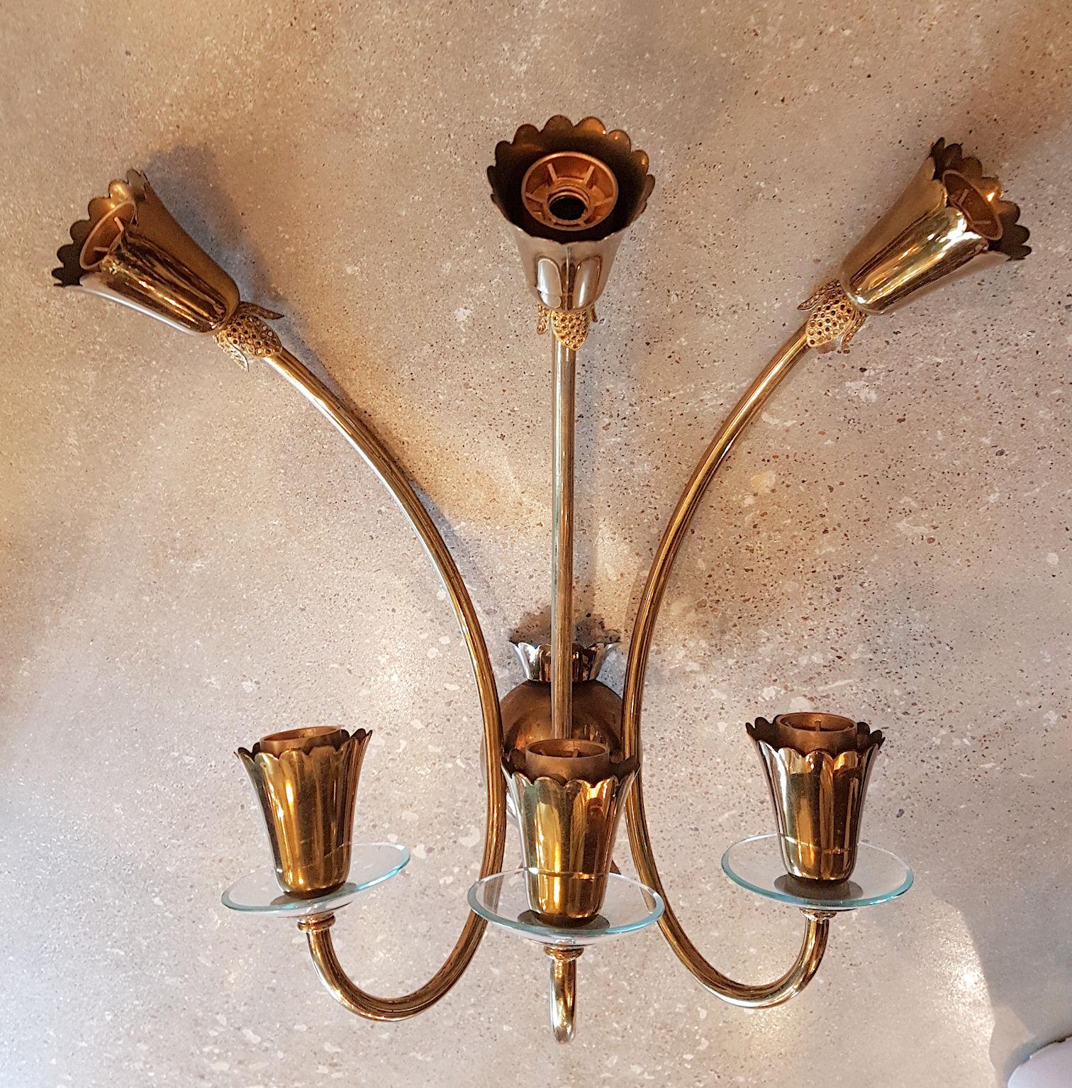 Pair of 6 lights Stilnovo style, Mid-Century Modern brass with clear glass Italian wall sconces.
Pure Stilnovo Italian midcentury style, elegant and simple.
They have been rewired, for candelabra base bulbs.