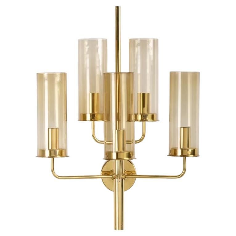 Pair of large Hans Agne Jakobson sconces, Produced at Hans-Agne Jakobsson own factory Markaryd in the 1970s.
Brass frames with 5 arms each holding a diffuser in smokey glass.

Rewired for the US.

Delivery in the NYC area can be arranged.

