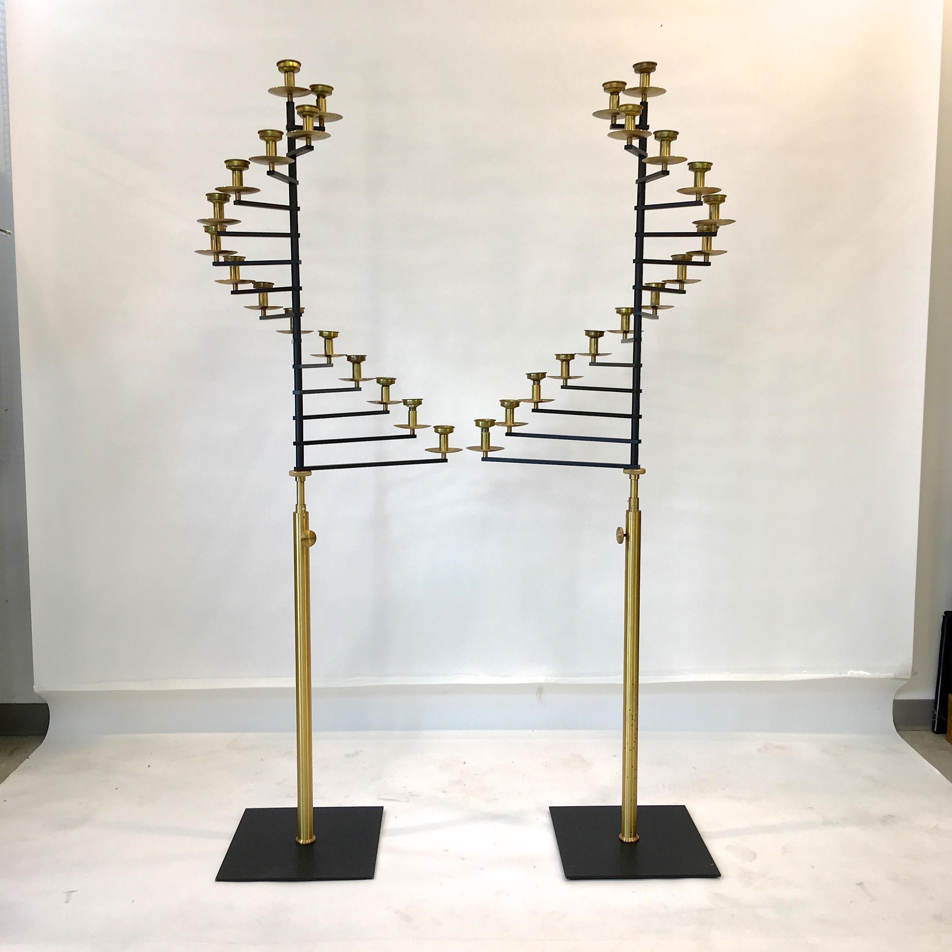 Pair of 6 foot 3 inch tall 15-light brass spiral fan candelabra, circa 1960, from a deconsecrated Rhode Island church.

Quite well constructed with solid brass adjustable stem, solid brass knurled knobs, 14 flat black enameled brass arms of