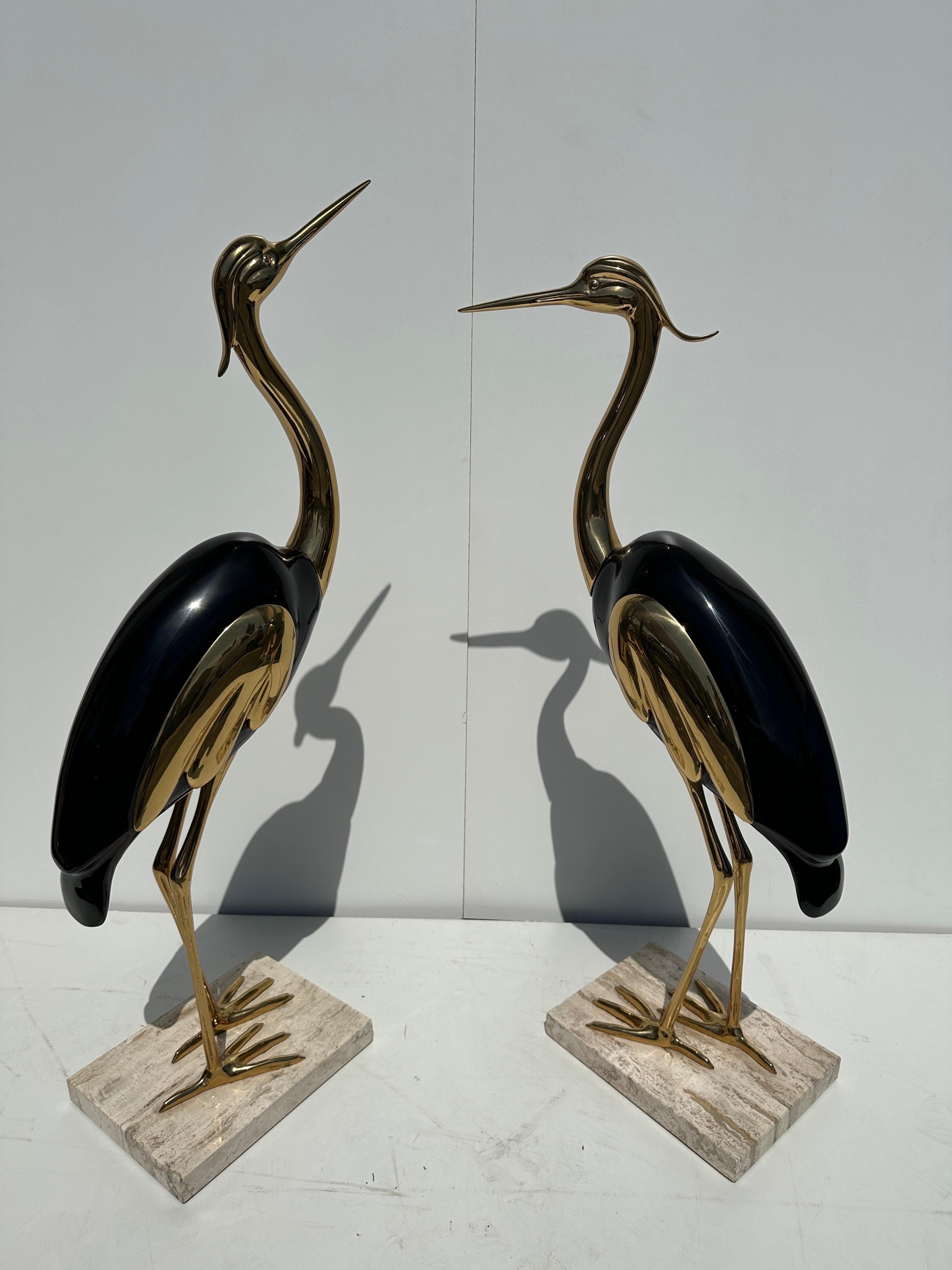 Pair of Italian brass and lacquered wood heron / crane sculptures attributed to Antonio Pavia. Travertine base has some small chipping in the corner.