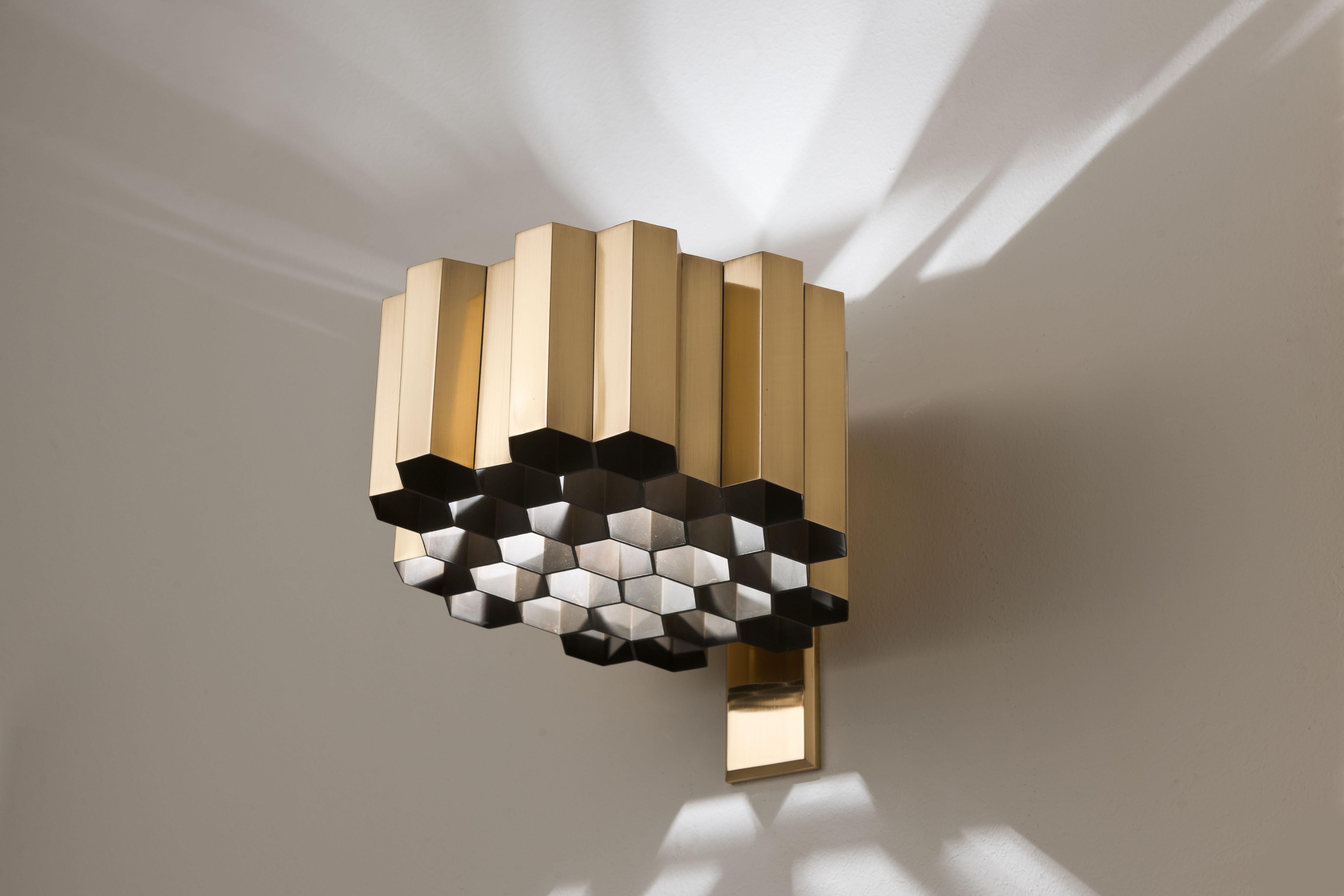 Pair of vary rare Honeycomb wall sconces, designed in 1953 by Belgium Designer Jules Wabbes (1919-1974), Laiton, Belgium, 1960. 
The Honeycomb wall lamp is composed of 32 hexagonal brass tubes brazed by hand. This lamp was designed for the high