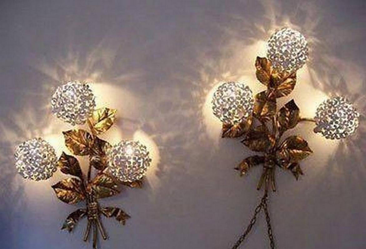 These sconces have been designed by Italian artist Palladio.
They have their original gold finish and lacquer which are in excellent shape.
They create beautiful shadows on the wall when lit.