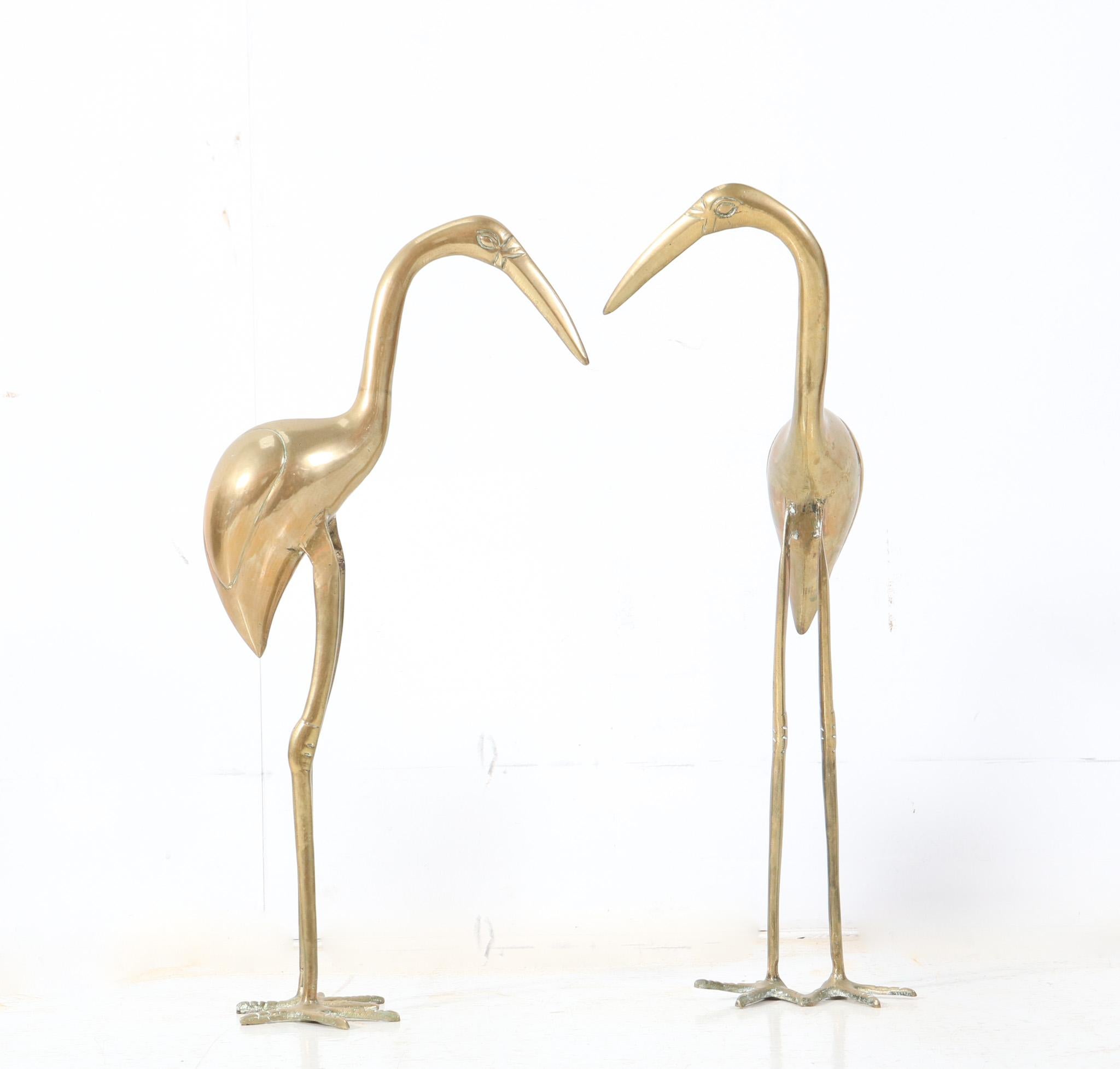 Stunning and elegant pair of Mid-Century Modern Flamingo sculptures.
Striking Italian design from the 1970s.
Executed in brass and monumental in size and drama.
This wonderful pair of Mid-Century Modern Flamingo sculptures is in very good original