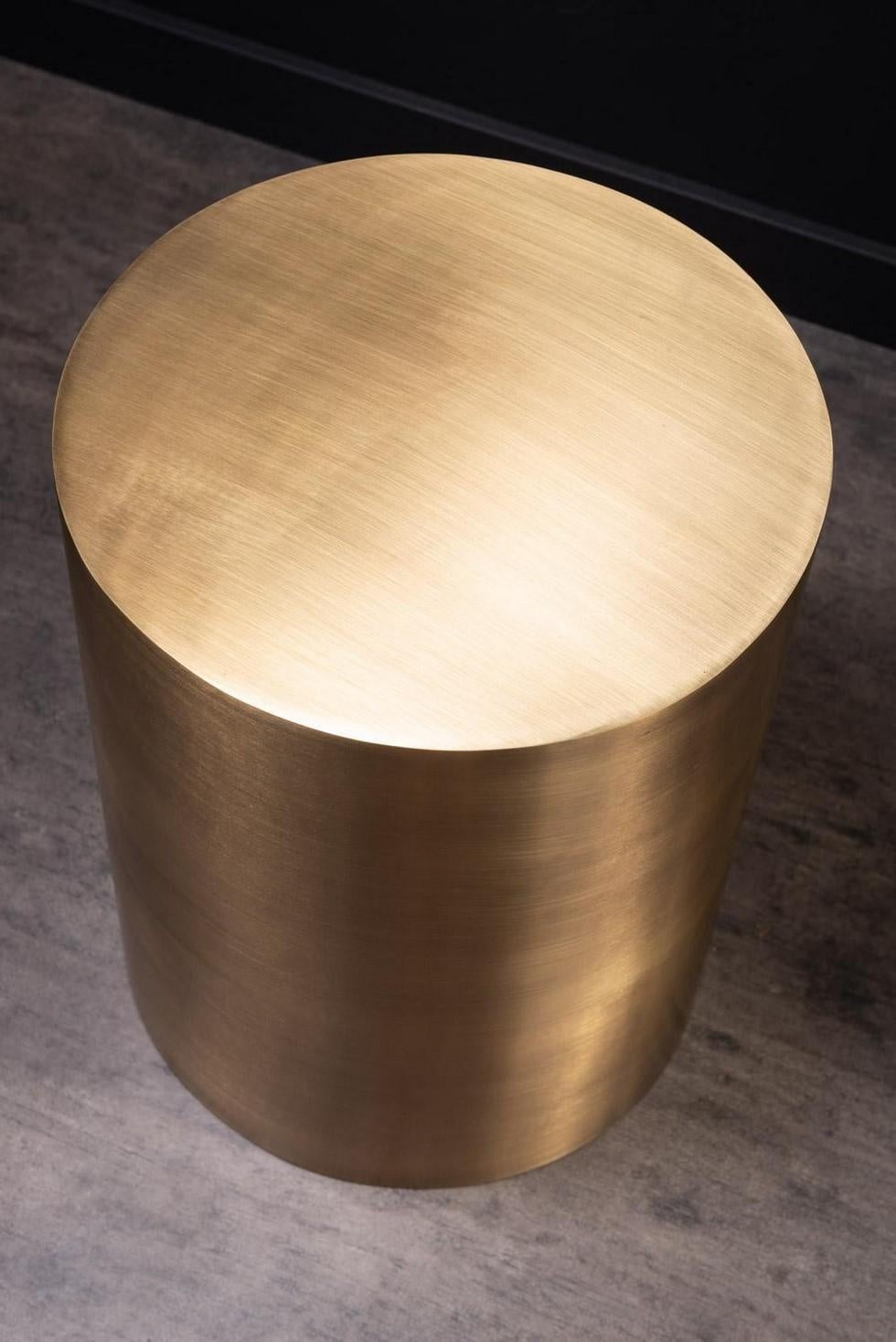 Pair of MCM design style brass metal cylindrical side tables.