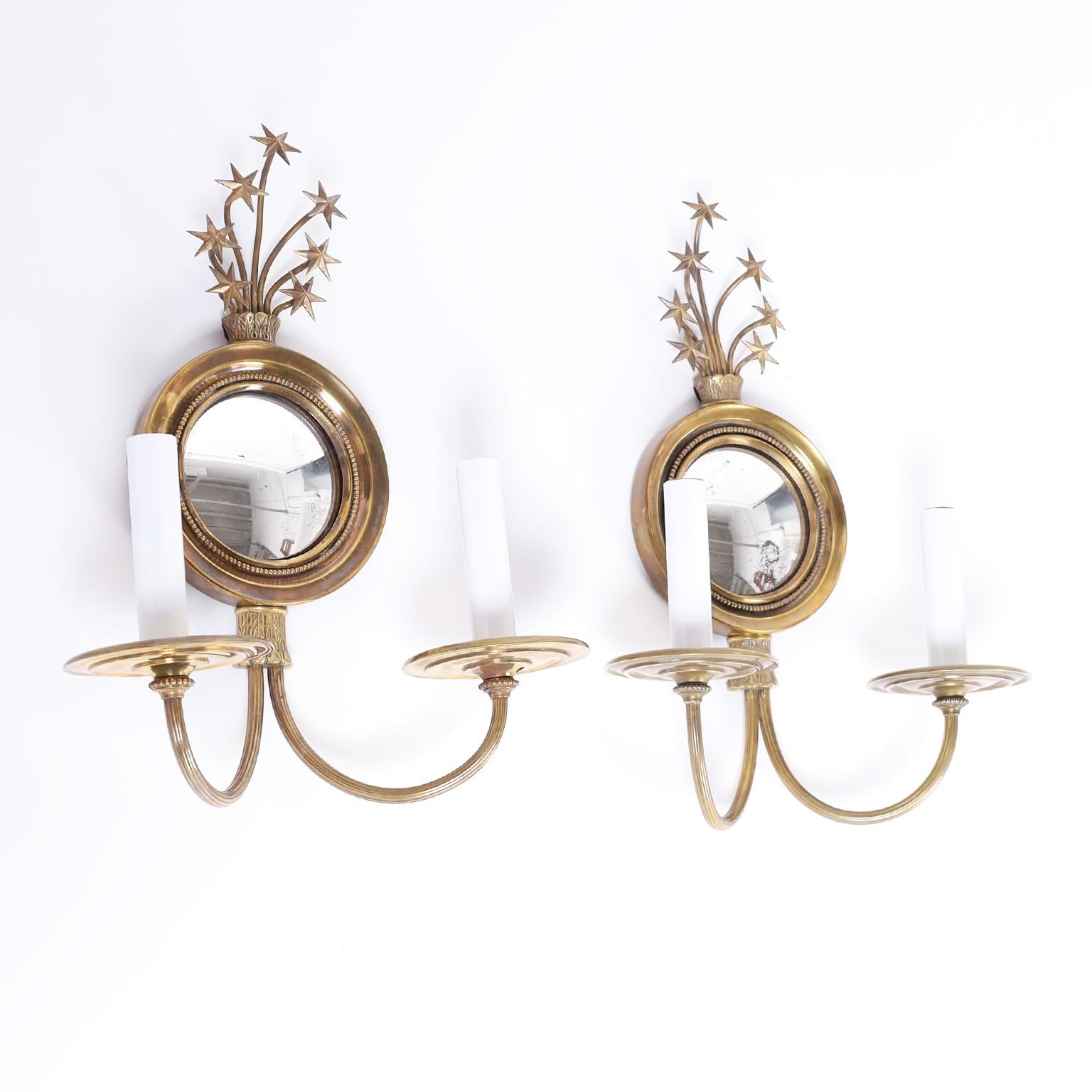 Pair of antique brass federal style two light wall sconces with convex mirrors and star bursts at the top, all in a tight classic form. As seen in the last photo of the listing, a similar metal pair is also available.