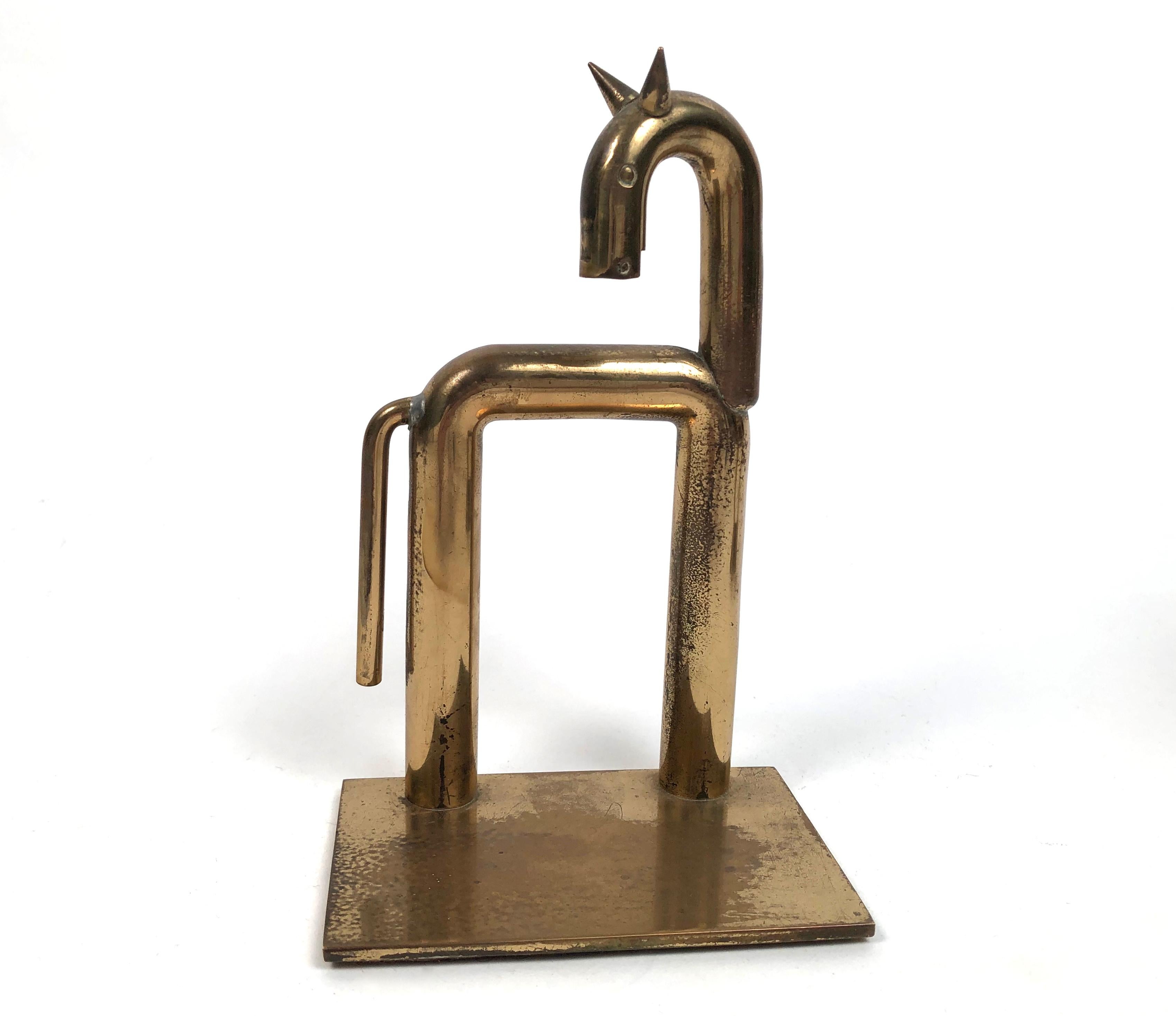 A pair of modernist brass stylized horse bookends, designed by Walter von Nessen (1889-1943) for the Chase Brass and Copper Company, Waterbury, Connecticut, circa 1931. These slick and wonderfully minimalist figural horse book ends look both ancient
