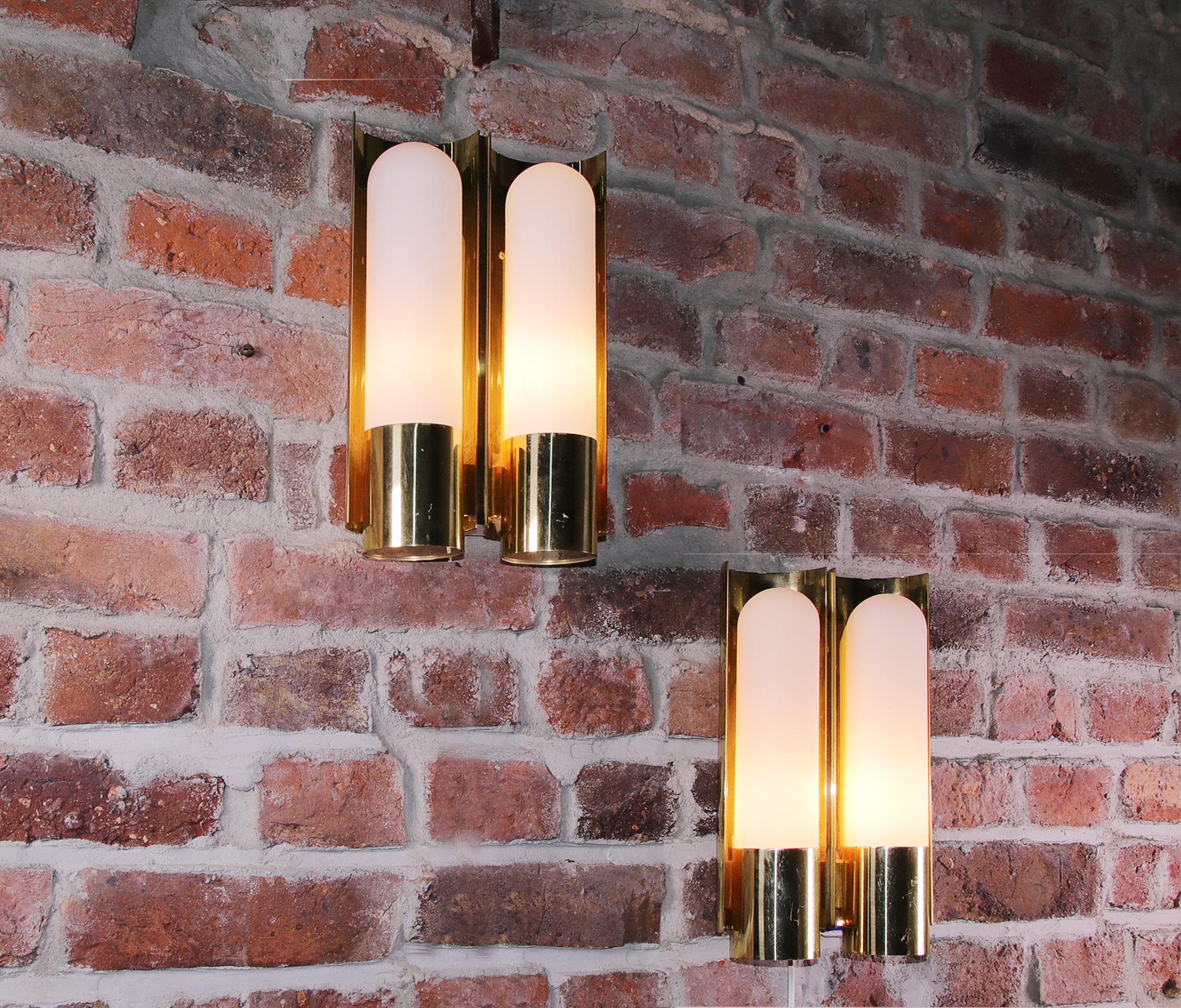 Elegant pair of wall lights with brass and opaline glass elements on a brass frame. Manufactured by Glashutte Limburg, Germany in the 1970s. 

Measures: width 7.87