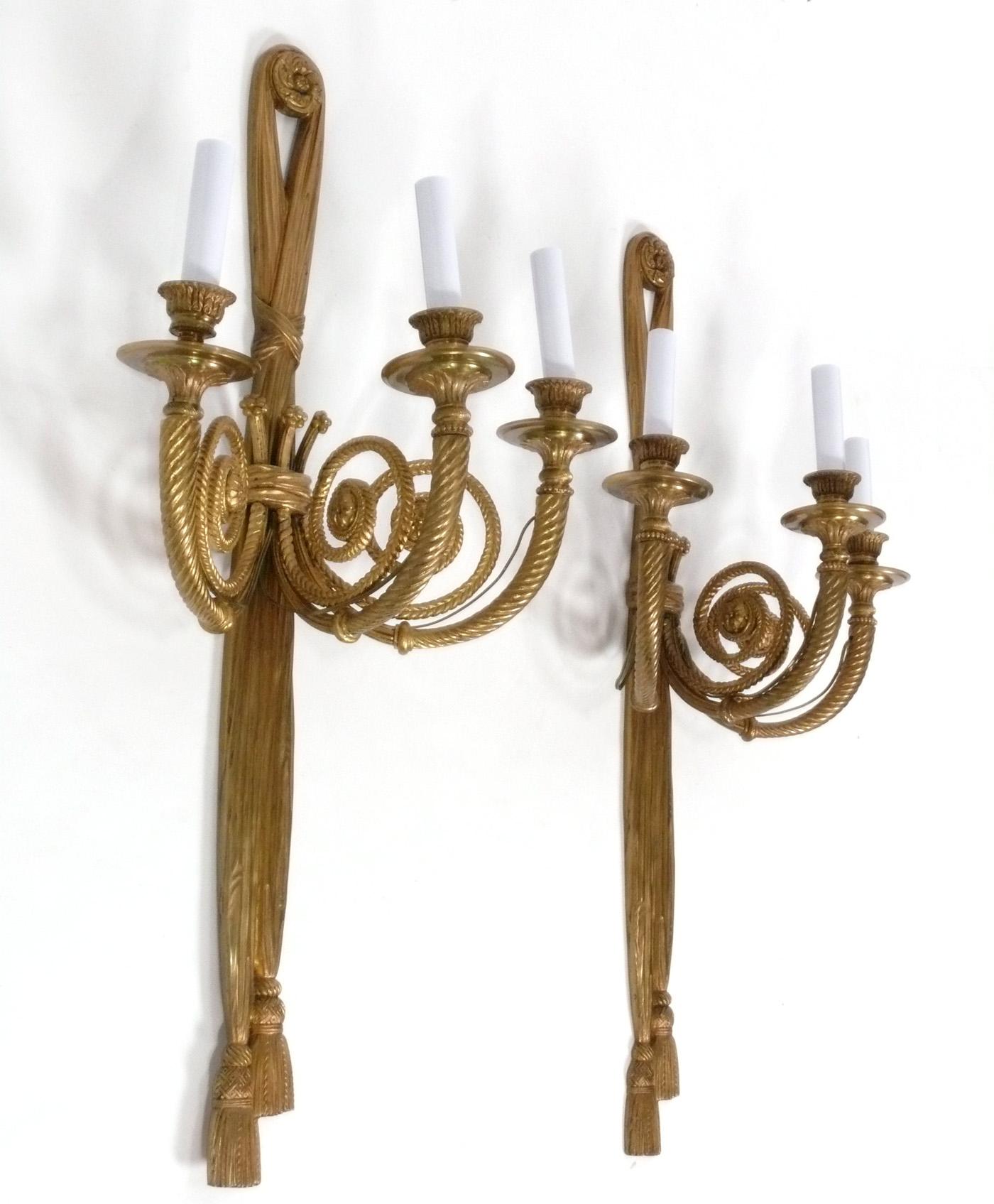 Pair of Elegant Brass or Bronze Sconces, attributed to the E.F. Caldwell Company, American, circa 1940s. They retain their warm original patina. They have been rewired and are ready to mount. 