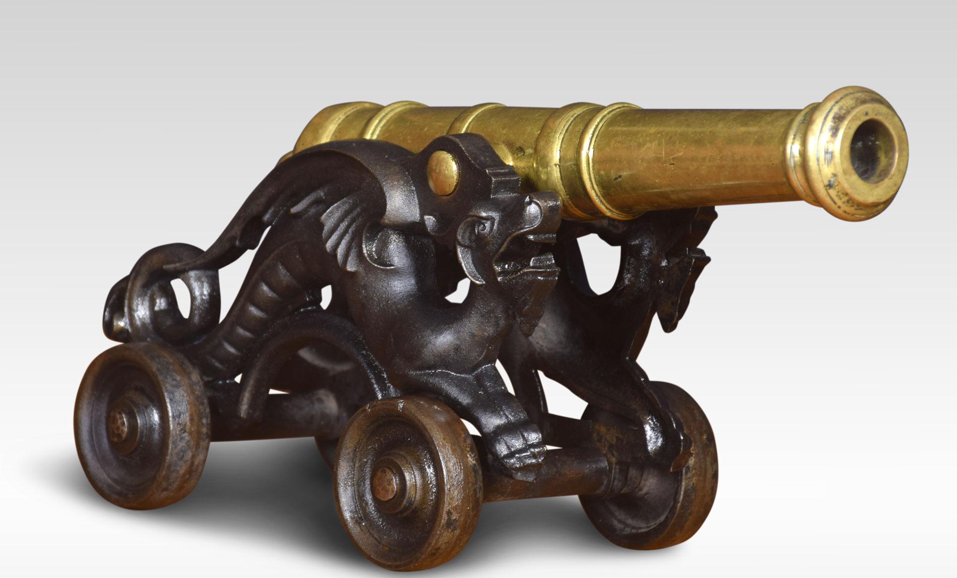 Pair of Chinese brass ornamental signal cannons on cast iron carriages. Each with solid brass 15 inch tilting barrel resting on a scrolled dragon frame above working wheels.
Dimensions:
Height 9 inches
Length 17.5 inches
width 6.5 inches.