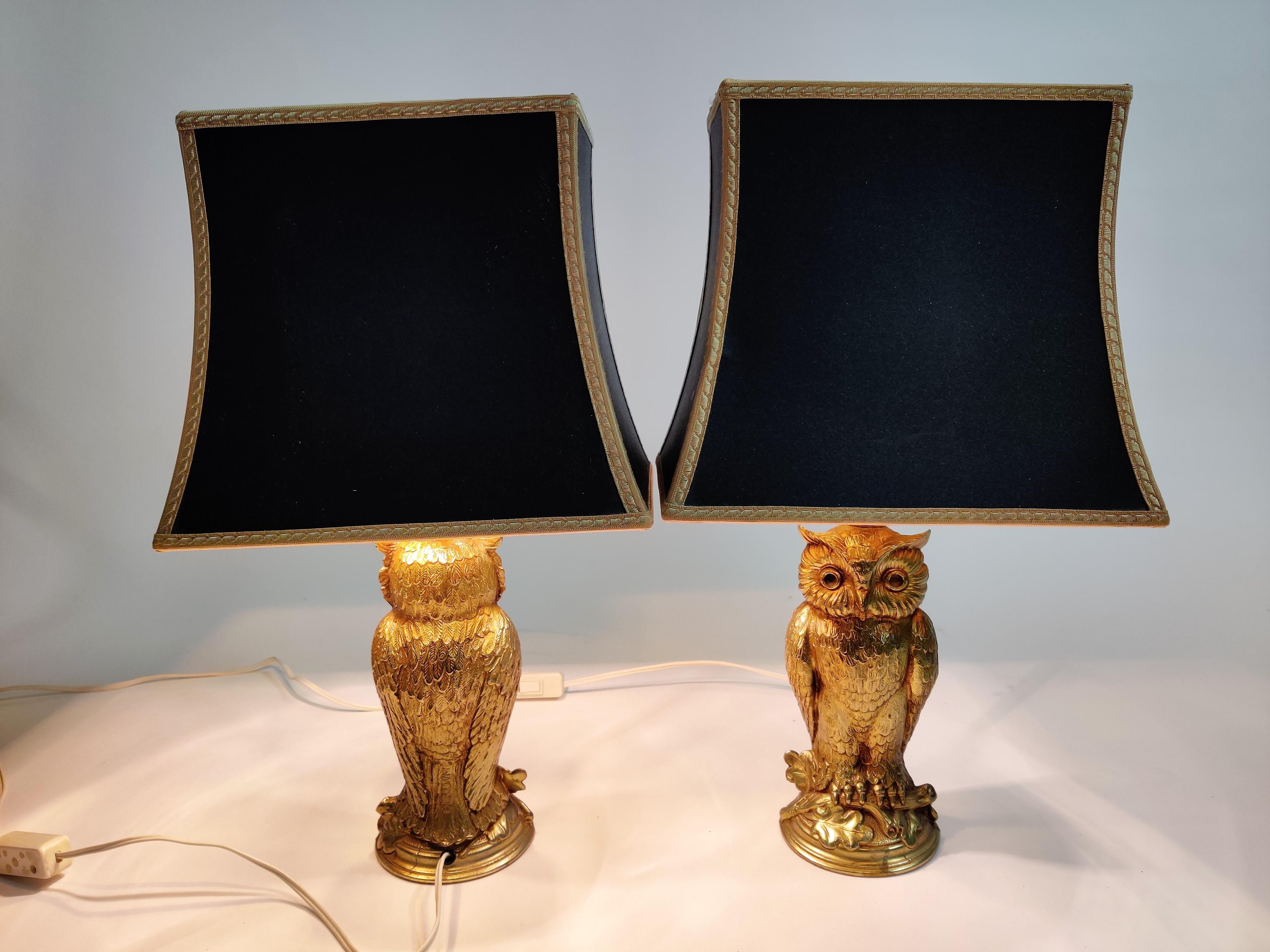 Pair of charming sculptural brass owl lamps made by Loevsky & Loevsky and sold by Deknudt lighting company.

The lamps are tested, work with a regular E27 light bulb and come with their original lamp shades.

Loevsky & Loevsky produced these