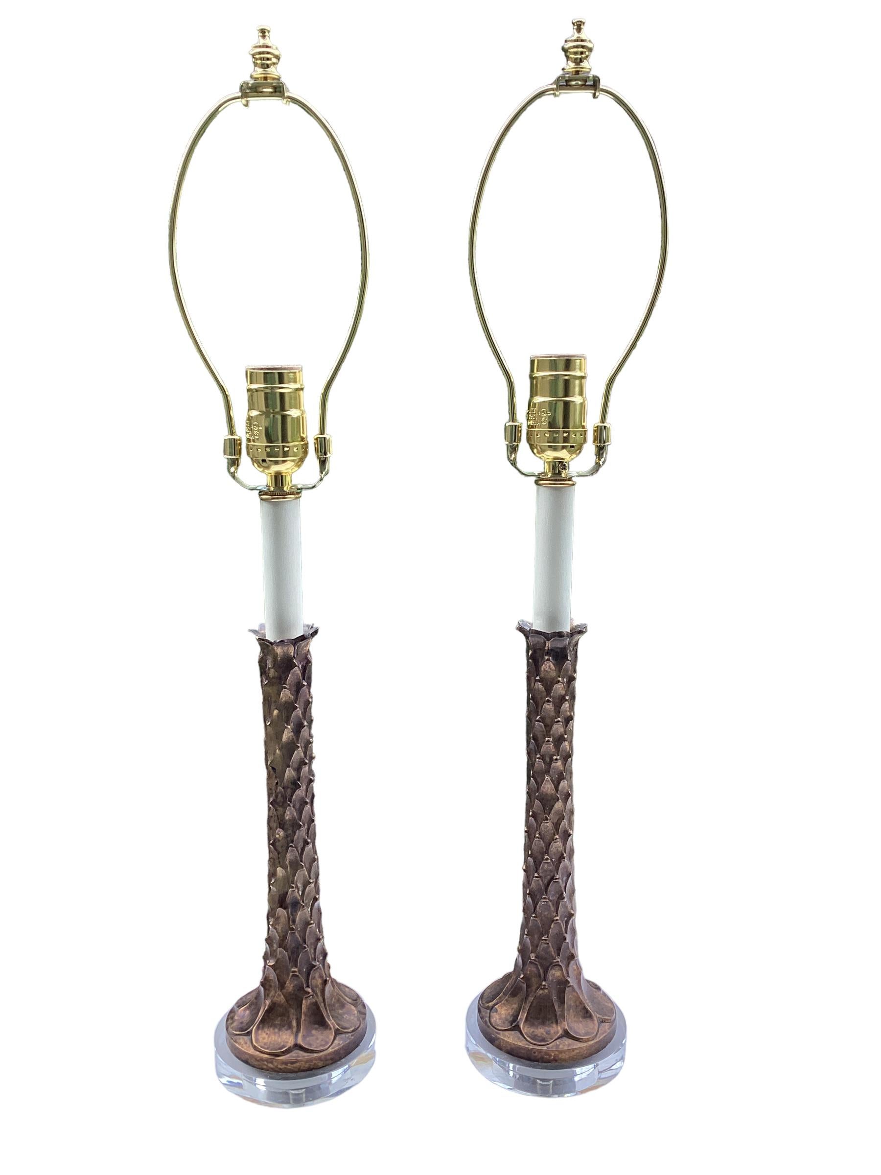 Pair of Brass Palm Tree Candlestick Lamps. Palm tree form shaft mounted on round lucite bases to give candlesticks a modern twist. Lamps are newly wired and have a 3-way socket for plenty of light.