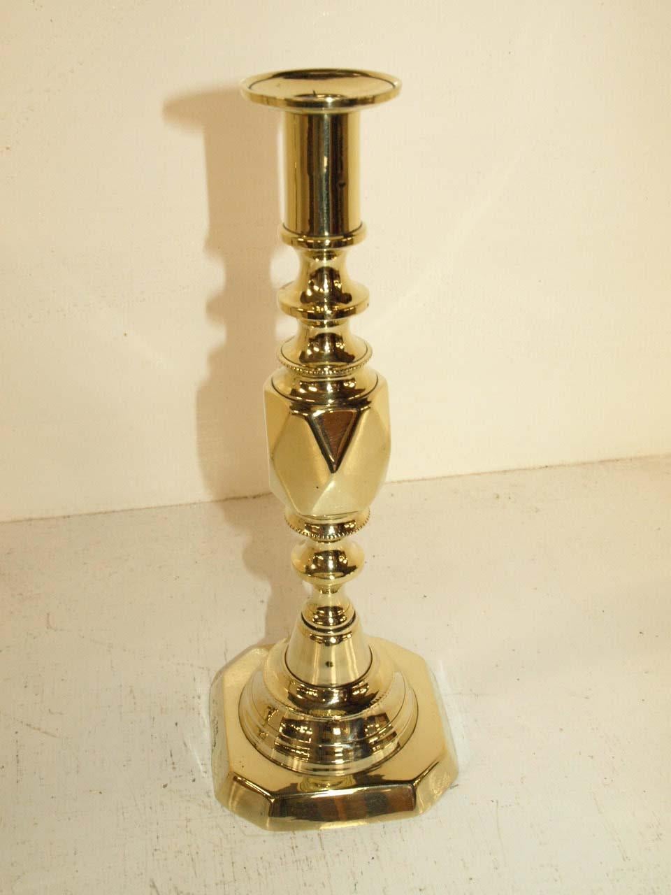 Pair of brass princess of diamond candlesticks, these are the smallest in the famous diamond series that include the queen, prince, king and ace of diamonds, standing 11' tall, they have the original push ups. This pair are recently polished not but