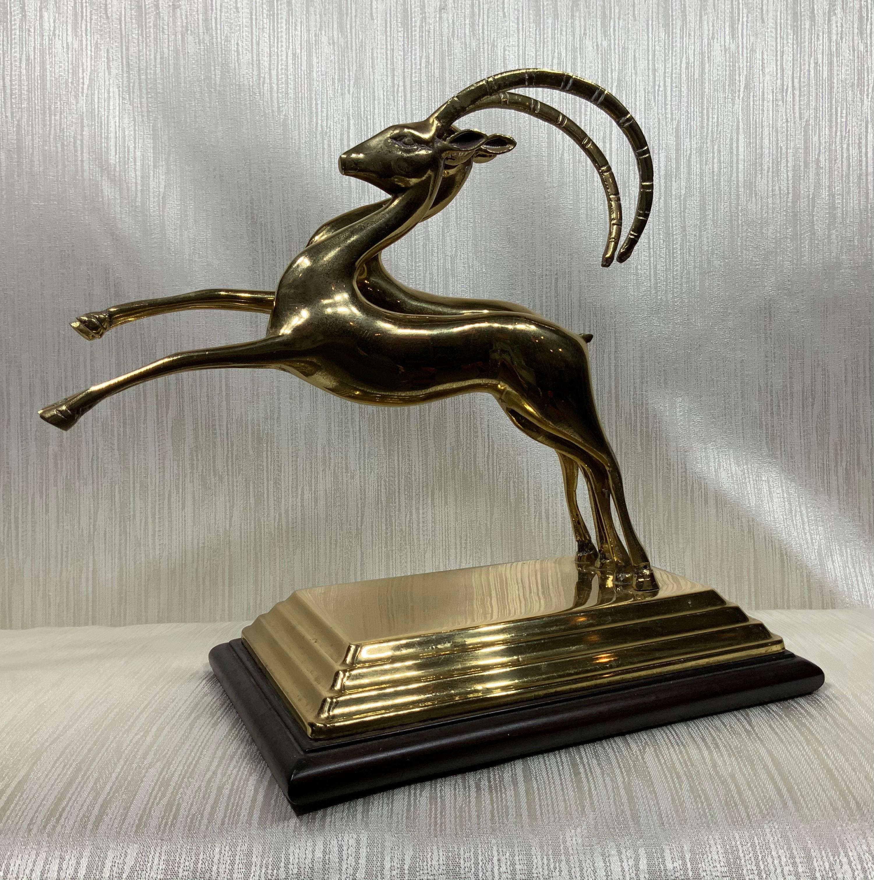 Elegant pair of ram made of solid brass, mounted on a base. Will make great addition to any room decor.