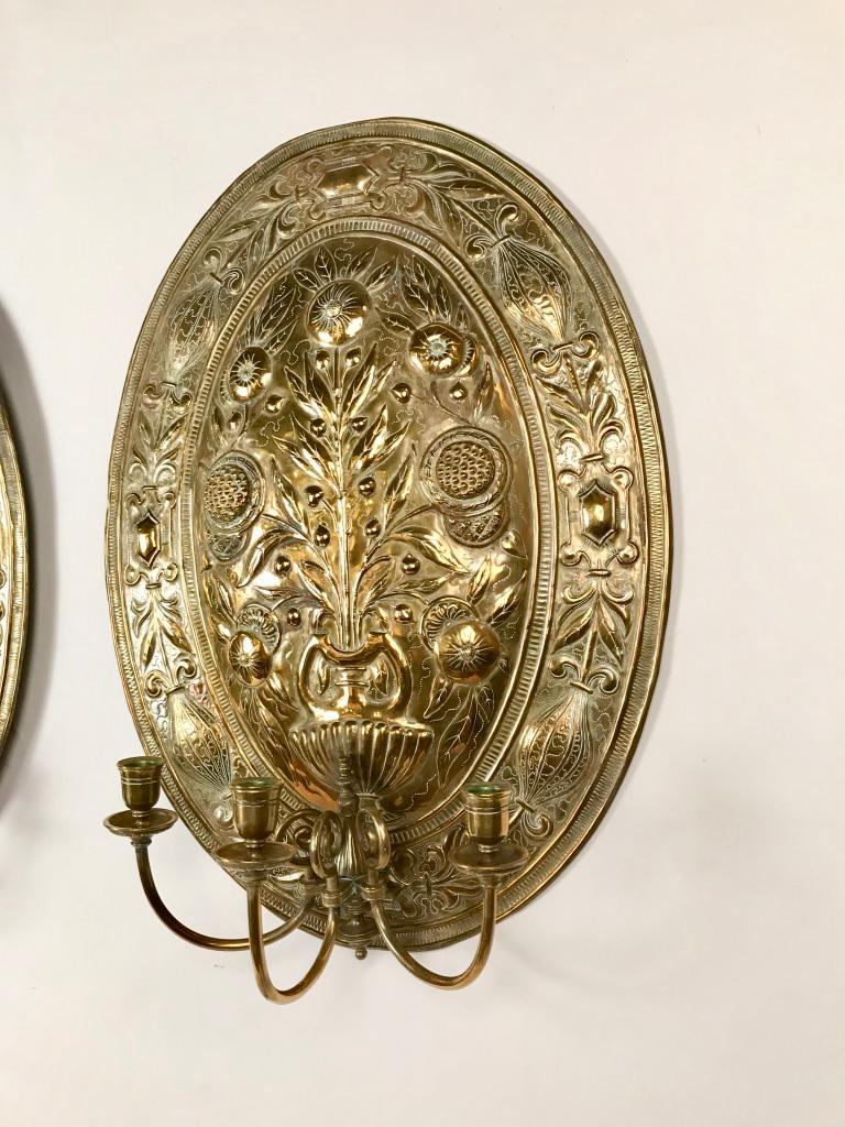 Dutch Colonial Pair of Brass Repoussé Three-Light Sconces