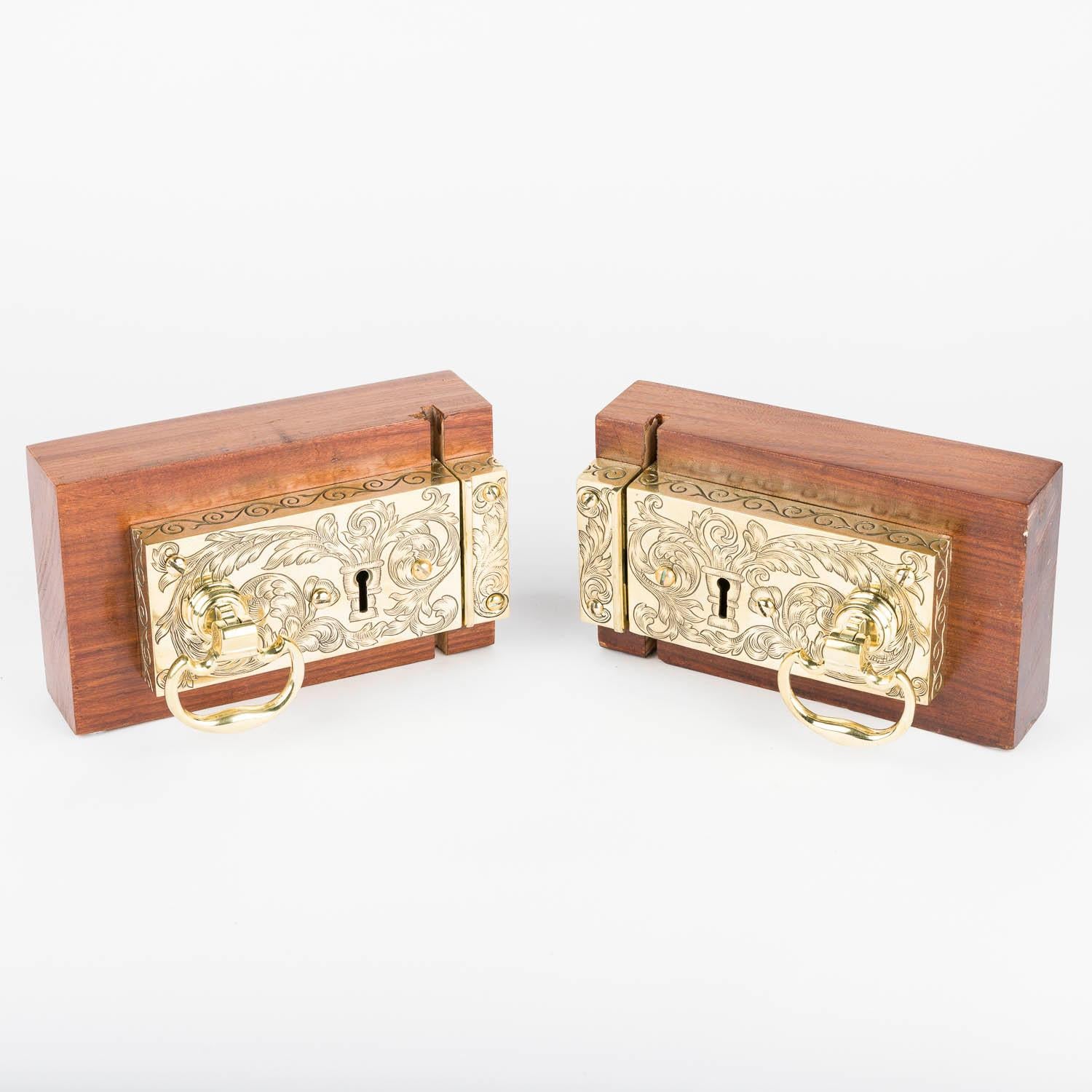 A pair of brass rim locks with the royal cipher of King George VI, circa 1935.

With original keeps, keys and handles.

Front with G VI R and four Crowns.

Back is abundantly engraved with floral decoration and scrollwork to edges.

Dimensions of