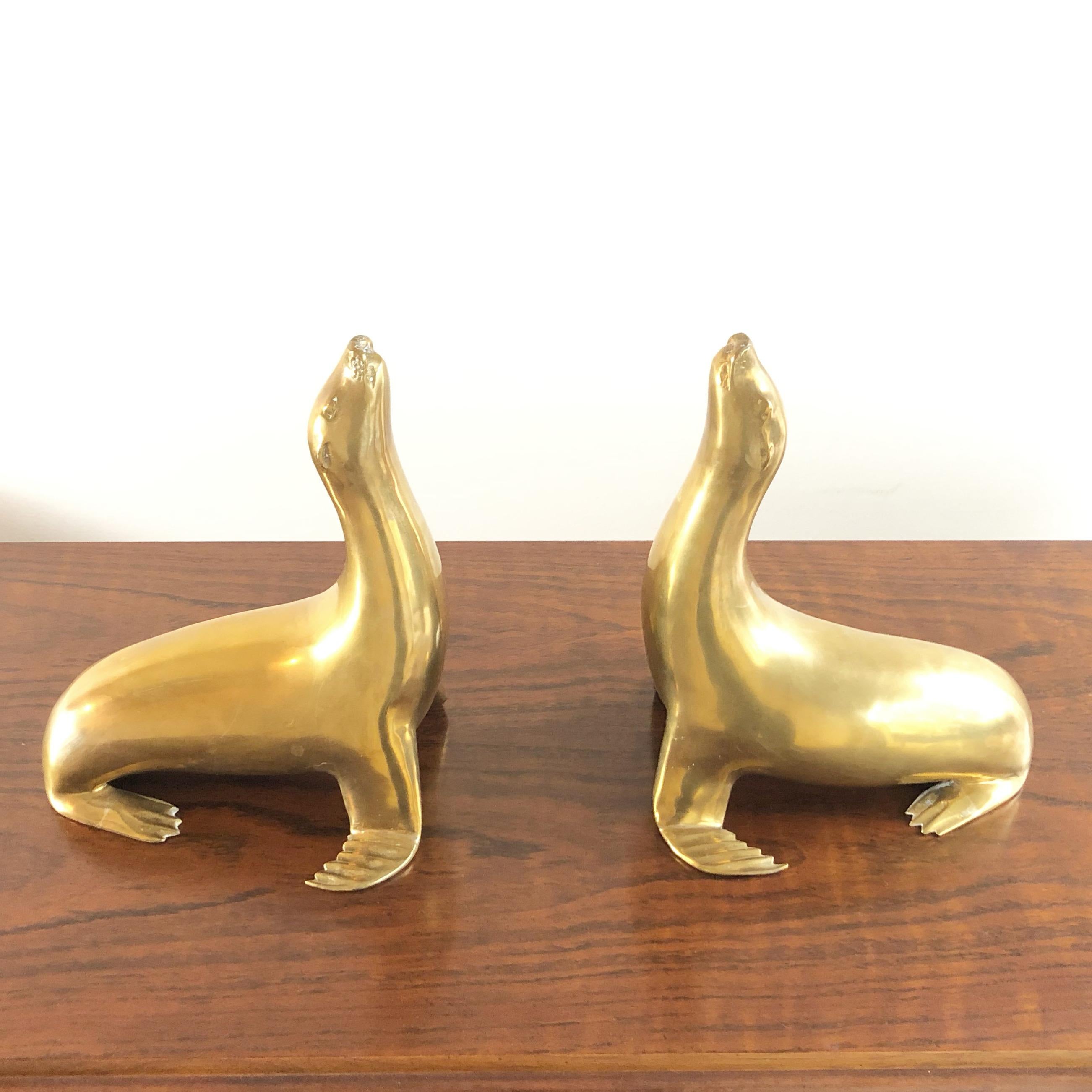 Pair of brass seal sculptures that could also be used as bookends.