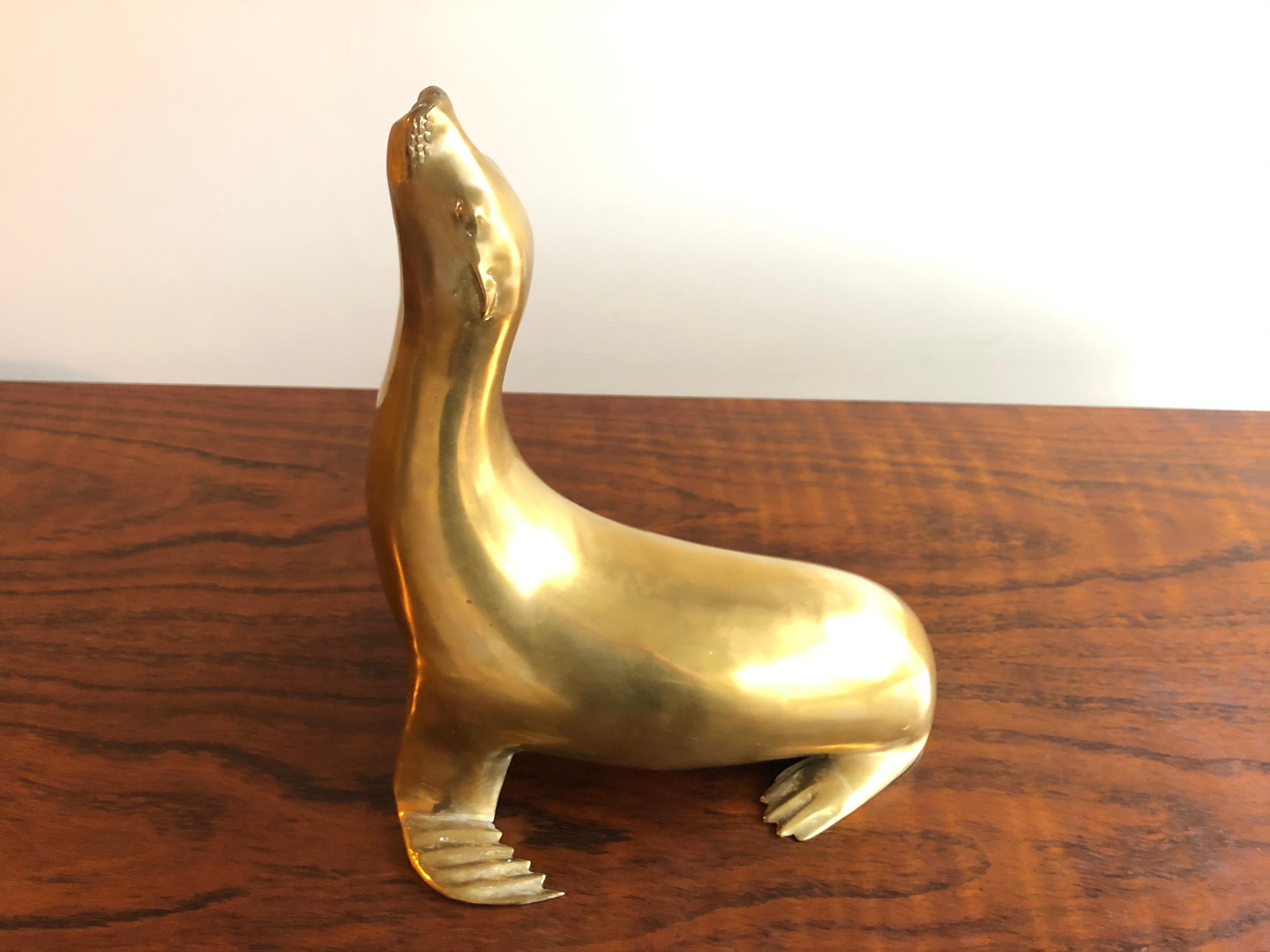 Cast Pair of Brass Seal Sculptures For Sale