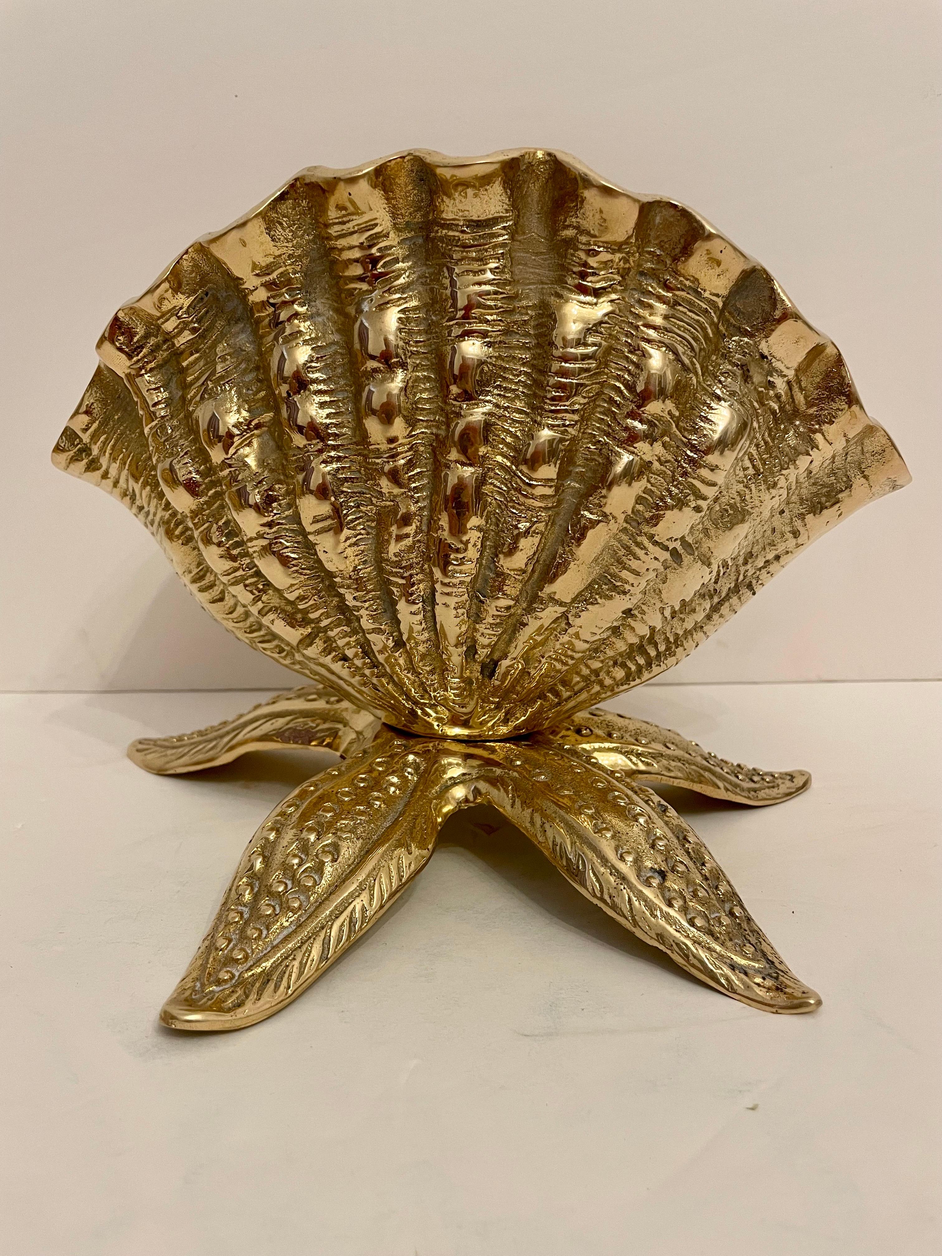 Pair of cast brass seashell nautilus planters on starfish base. This is a matching pair of planters. Good condition. Great for your beach house!