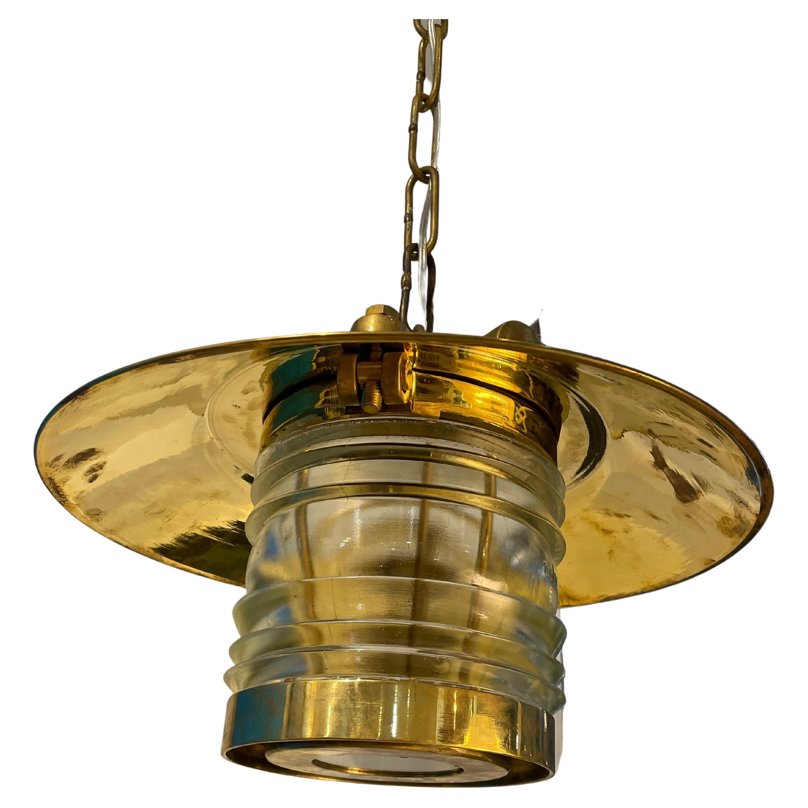 A pair of brass pendant lights from a decommissioned ship. The brass hat portion is 15