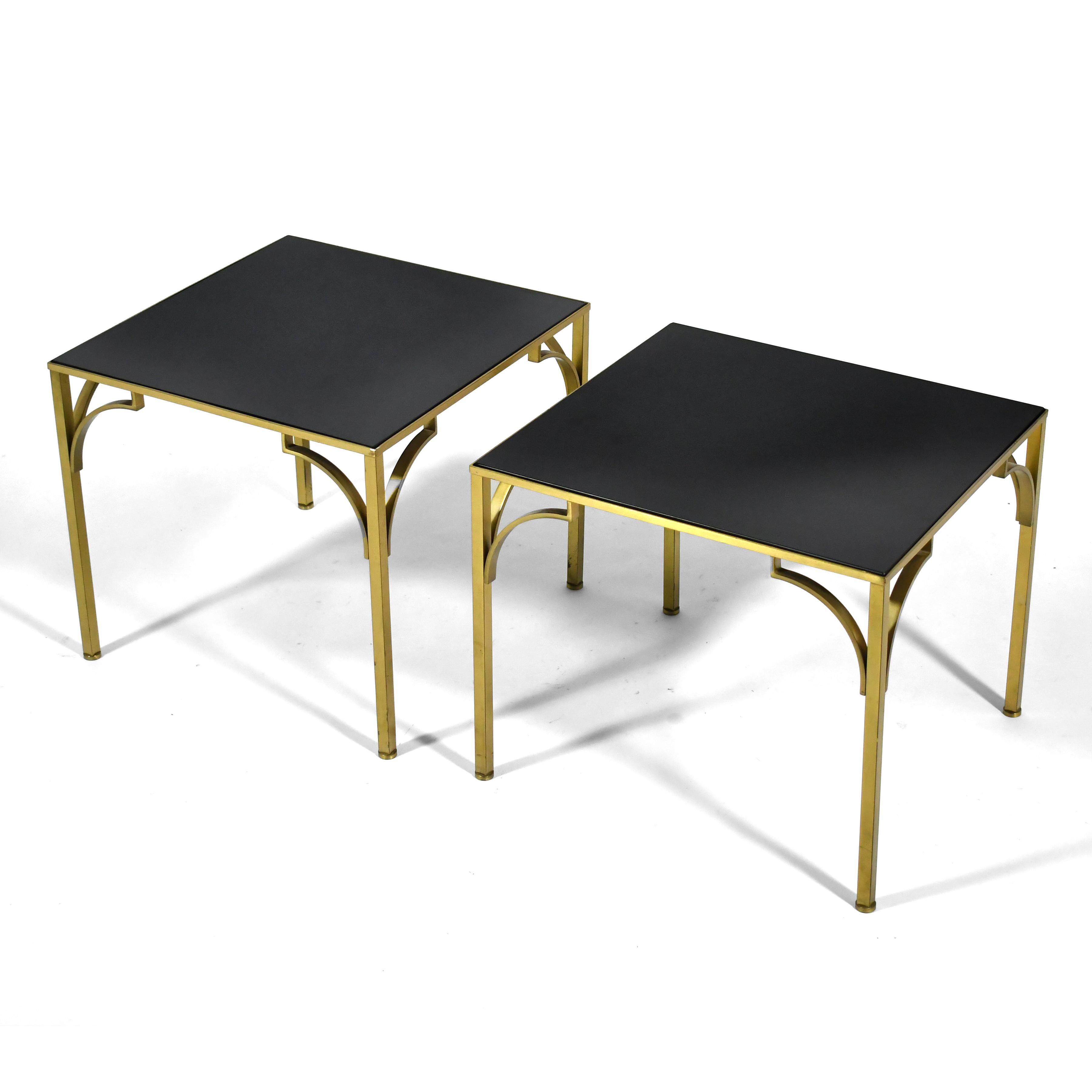 This handsome pair of German end tables have exquisitely crafted brass bases which support inset tops of black Detopak glass.

16.5