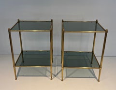 Pair of brass side tables with blueish glass shelves attributed to Maison Jansen