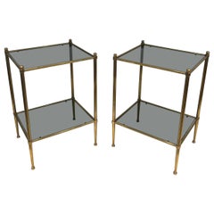 Pair of brass side tables with blueish glass shelves attributed to Maison Jansen Pair of brass side tables with blueish glass shelves attributed to Maison Jansen