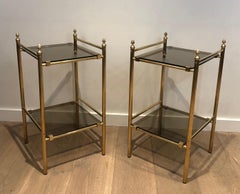 Pair of Brass Side Tables with Smoked Glass Shelves In the style of Maison Janse