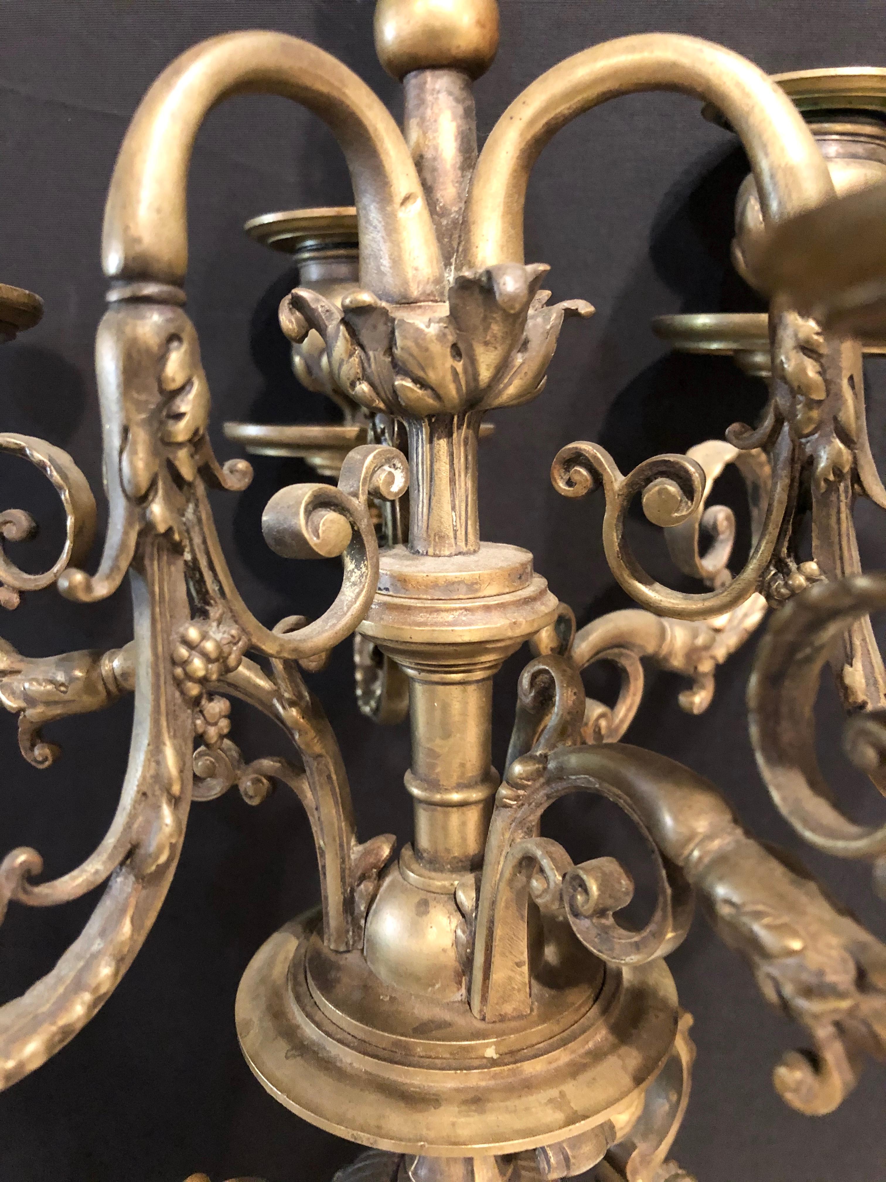 Pair of Brass Six-Arm Candelabras Bearing Figurative Faces and Fruits 5