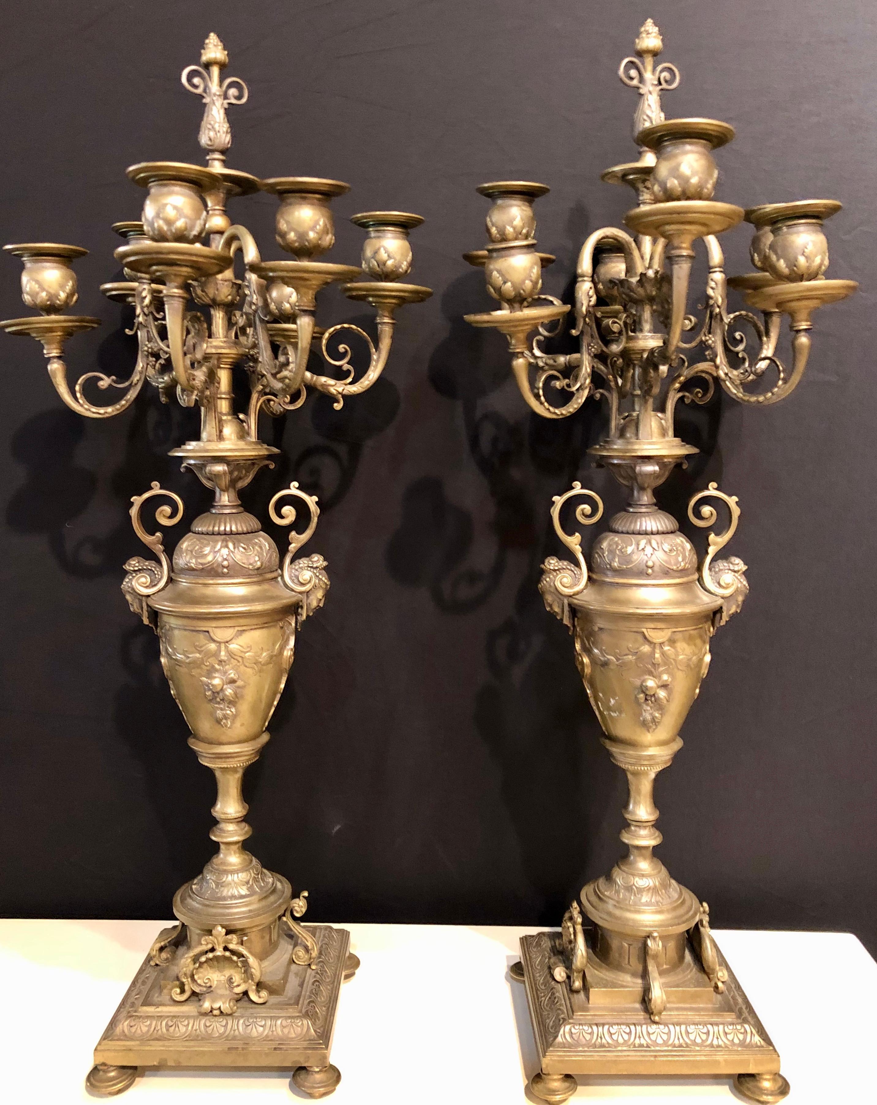 20th Century Pair of Brass Six-Arm Candelabras Bearing Figurative Faces and Fruits