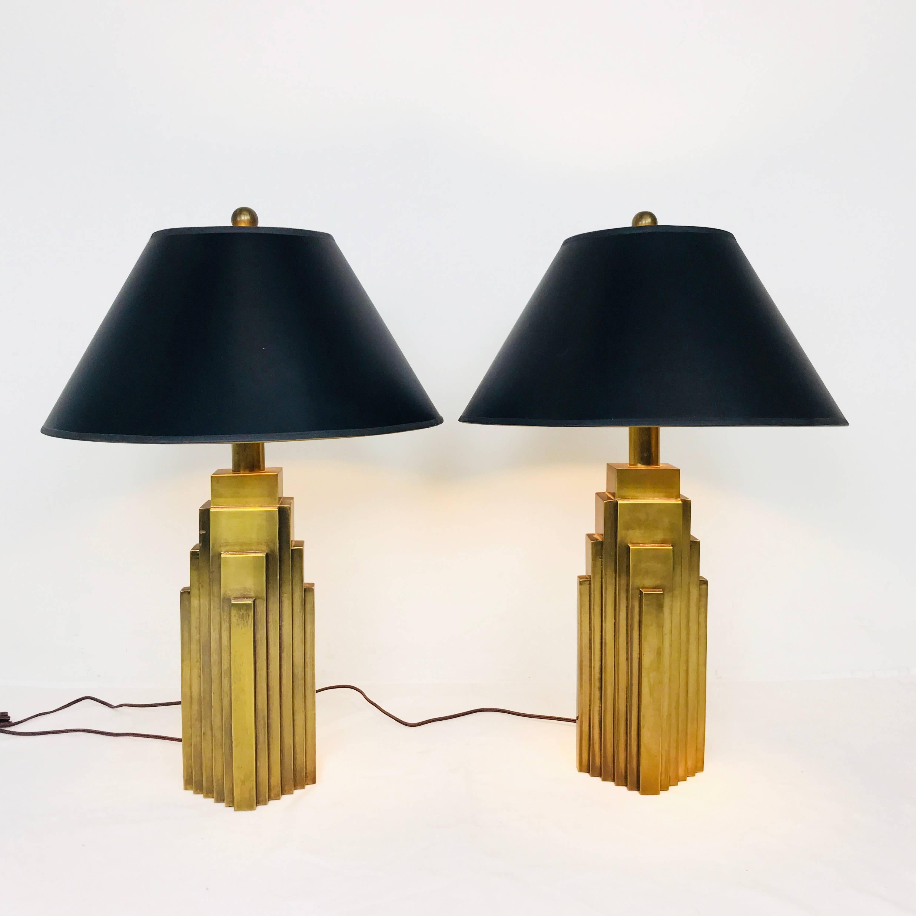 Pair of brass Skyscraper table lamps with black shades by Chapman. Lamps are in good vintage condition.

Dimensions: 6.5