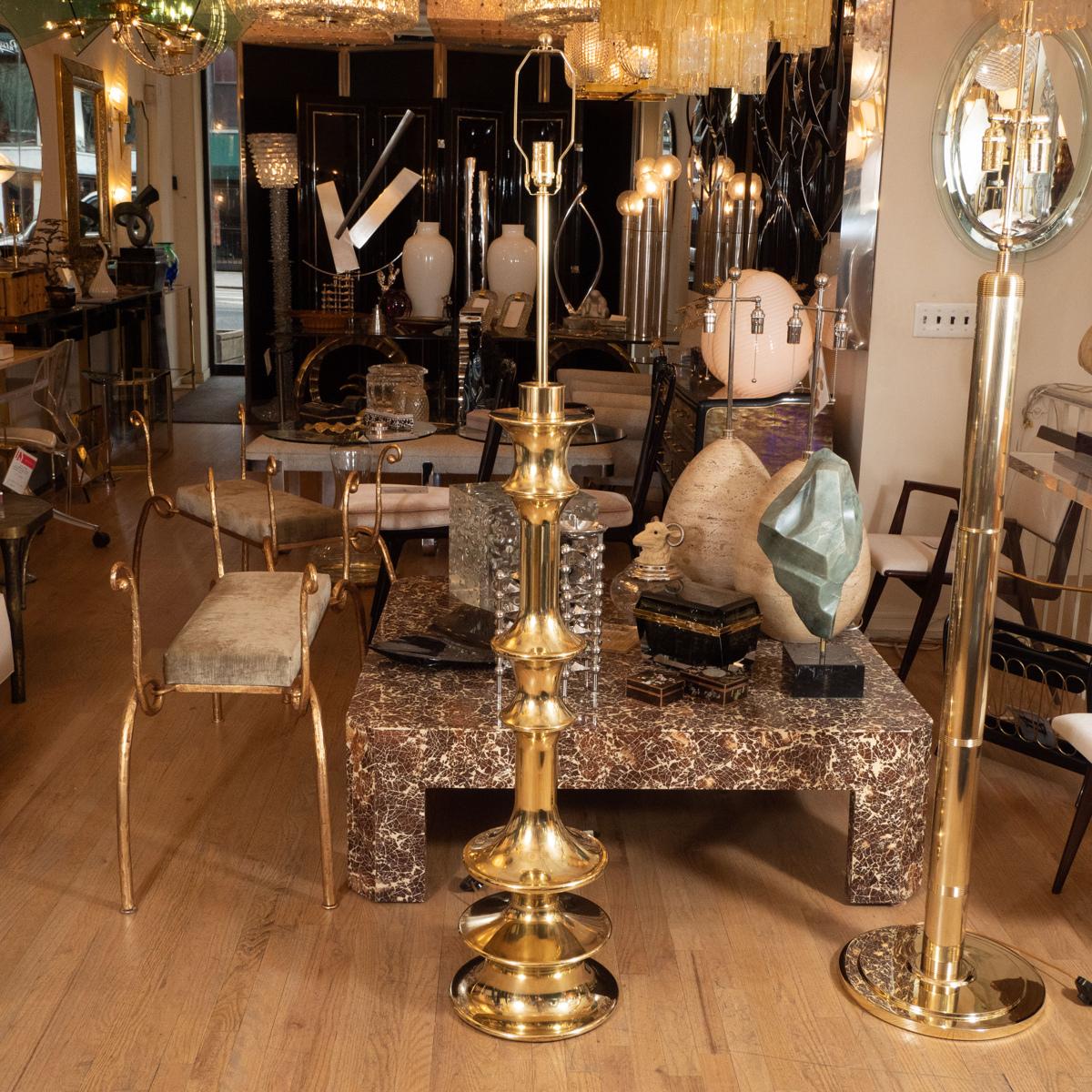 Pair of brass spindle form floor lamps.