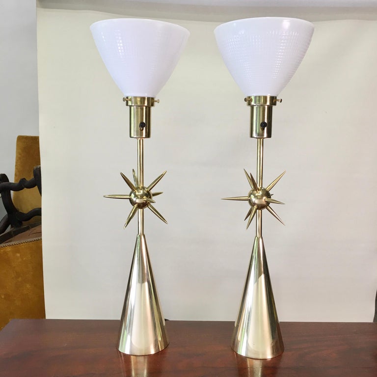 One of my favorite lamps. I love the atomic mace-like sputnik starburst ball of spikes seeming to hover above the crisp round brass conical base.
It is unclear who originally made it. Some say Laurel Lamp Mfg. Co. Others say Stiffel.
My only