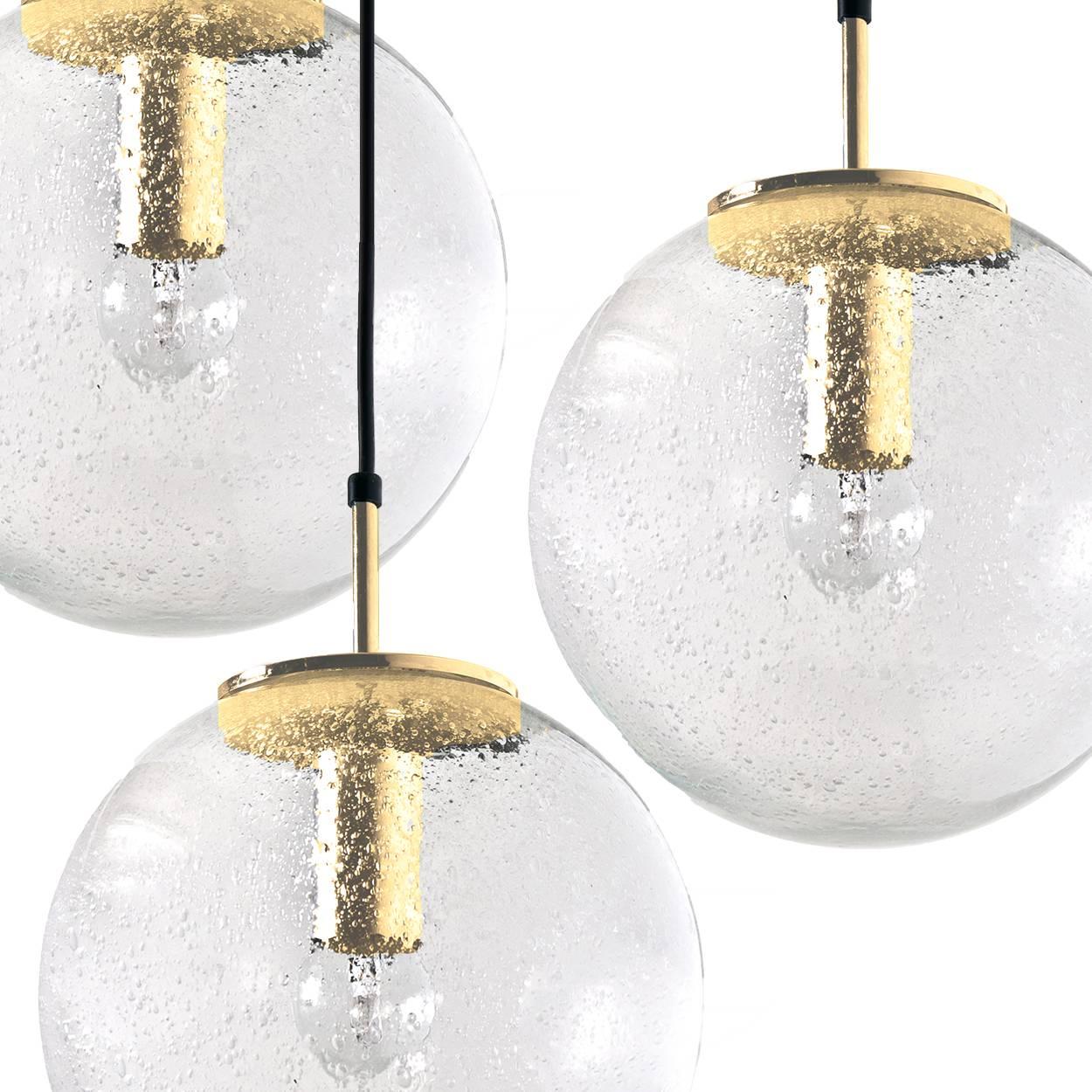 A pair of absolutely amazing huge ceiling mount pendant light fixtures with five globes or spheres by Limburg Glashütte. With hand blown glass pendants. Complete with a special new custom made ceiling plate for five globes. Very suitable for