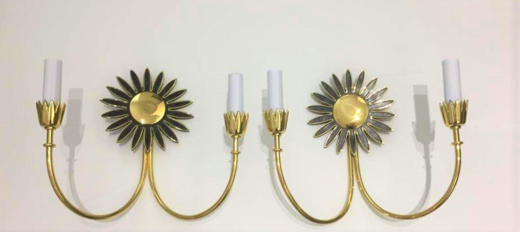 This stylish, chic and dare we say rare set of Mid-Century Modern wall scones were acquired in Italy and they have been professionally polished and rewired.

Note: The brass has also been lacquered and thus no tarnishing.