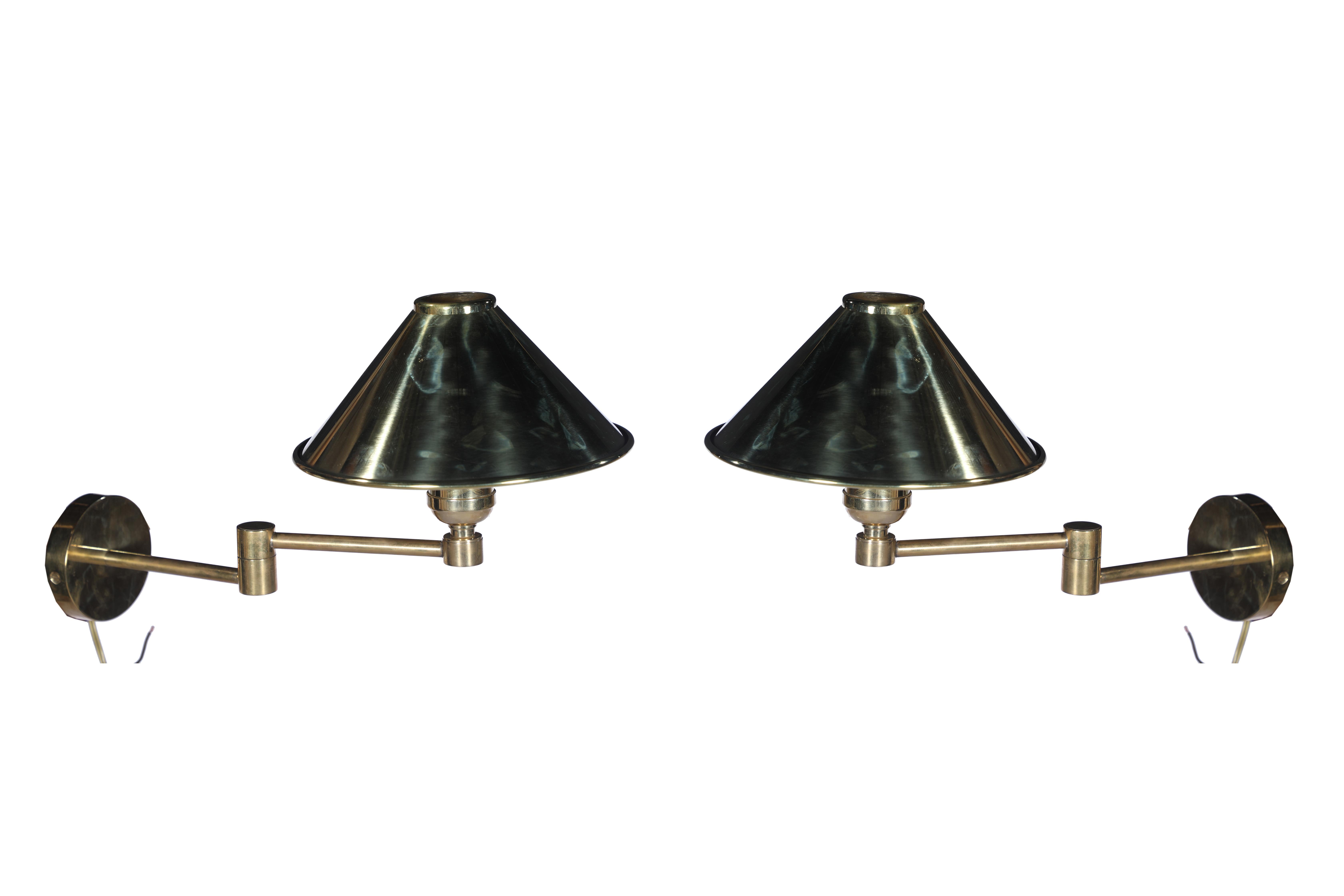 A pair of brass, swing-arm bunk lights from a ship's stateroom. Measures 11