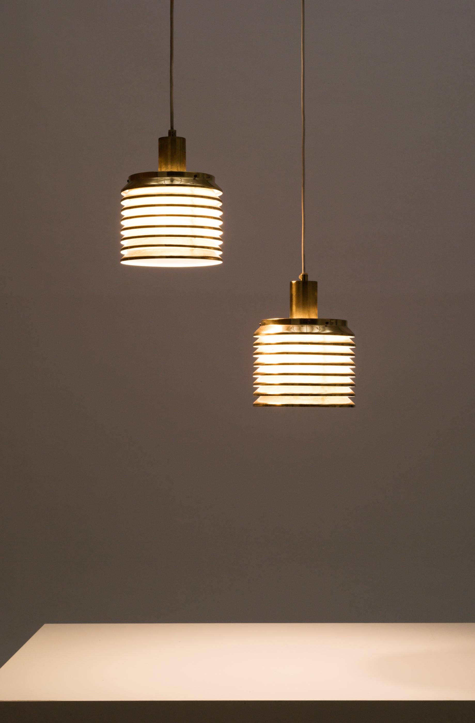 Pair of brass pendant lights, model T642, designed/produced by Hans-Agne Jakobsson, Markaryd Sweden, 1960s.