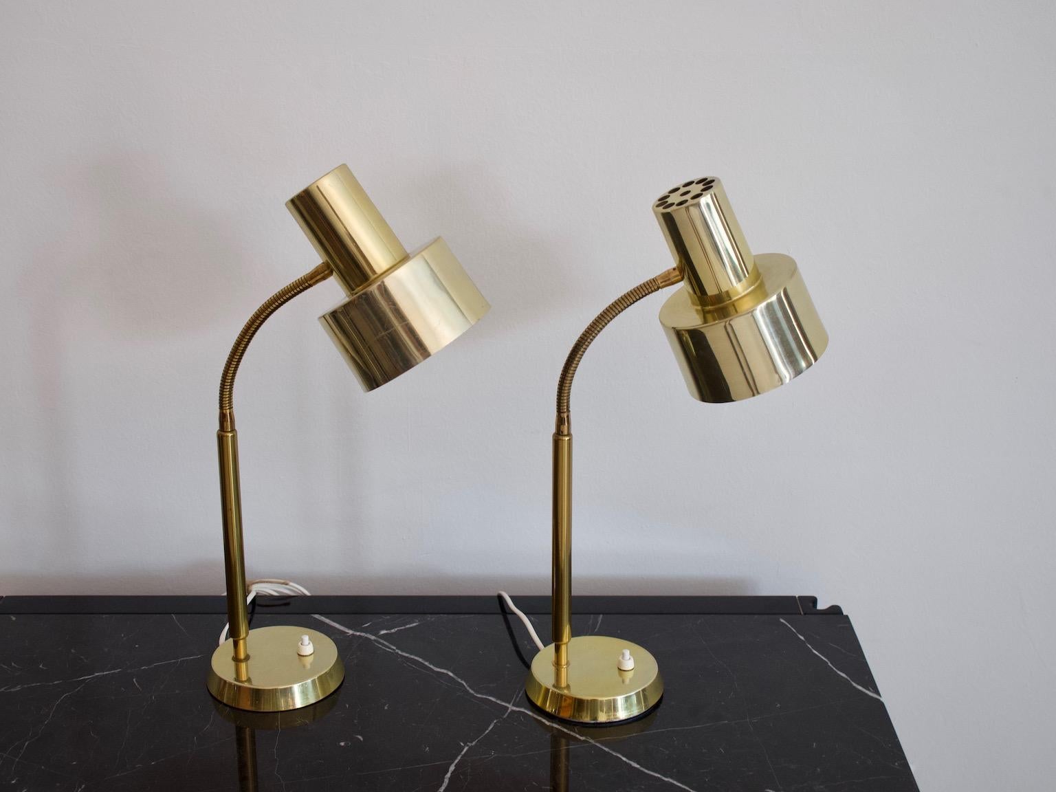 Pair of brass table lamps with adjustable light spot. Manufactured and labeled by 