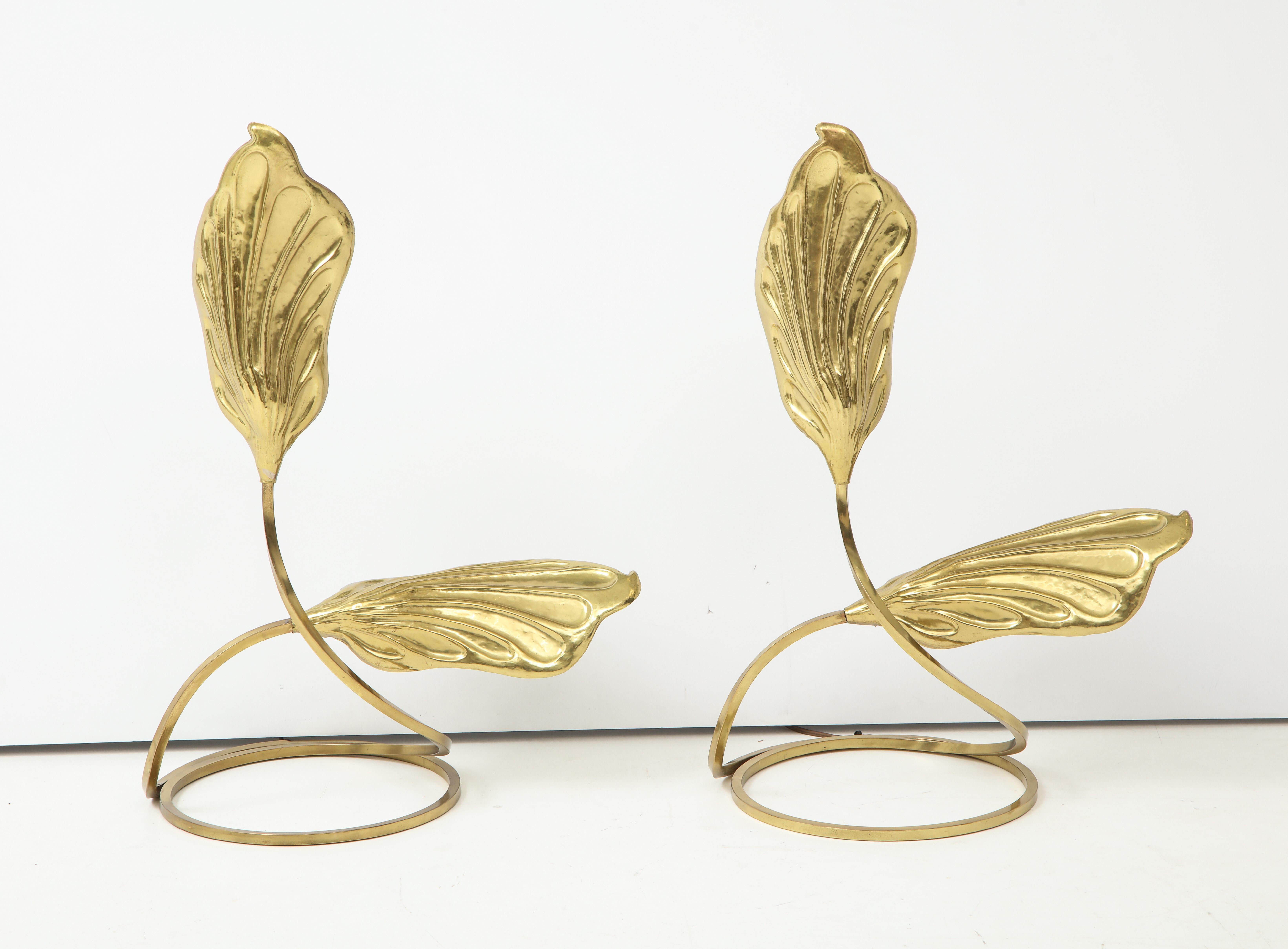 Pair of brass table lamps by Tomasso Barbi stylized leaves curve up from a circular base.