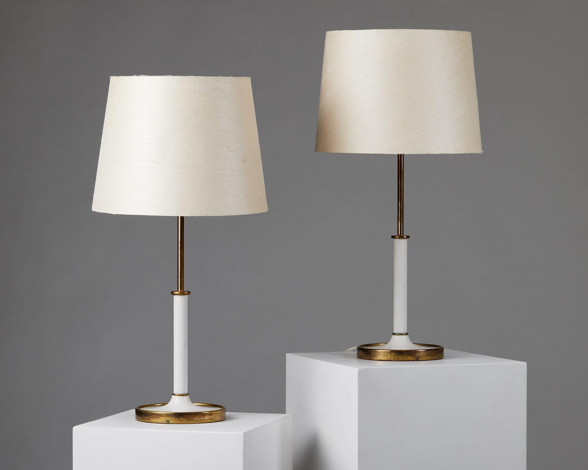 Pair of table lamps model 2466 designed by Josef Frank for Svenskt Tenn,
Sweden, 1950s.

Brass, lacquered brass and original fabric shades.

Stamped.

Josef Frank was a true European, he was also a pioneer of what would become classic 20th century