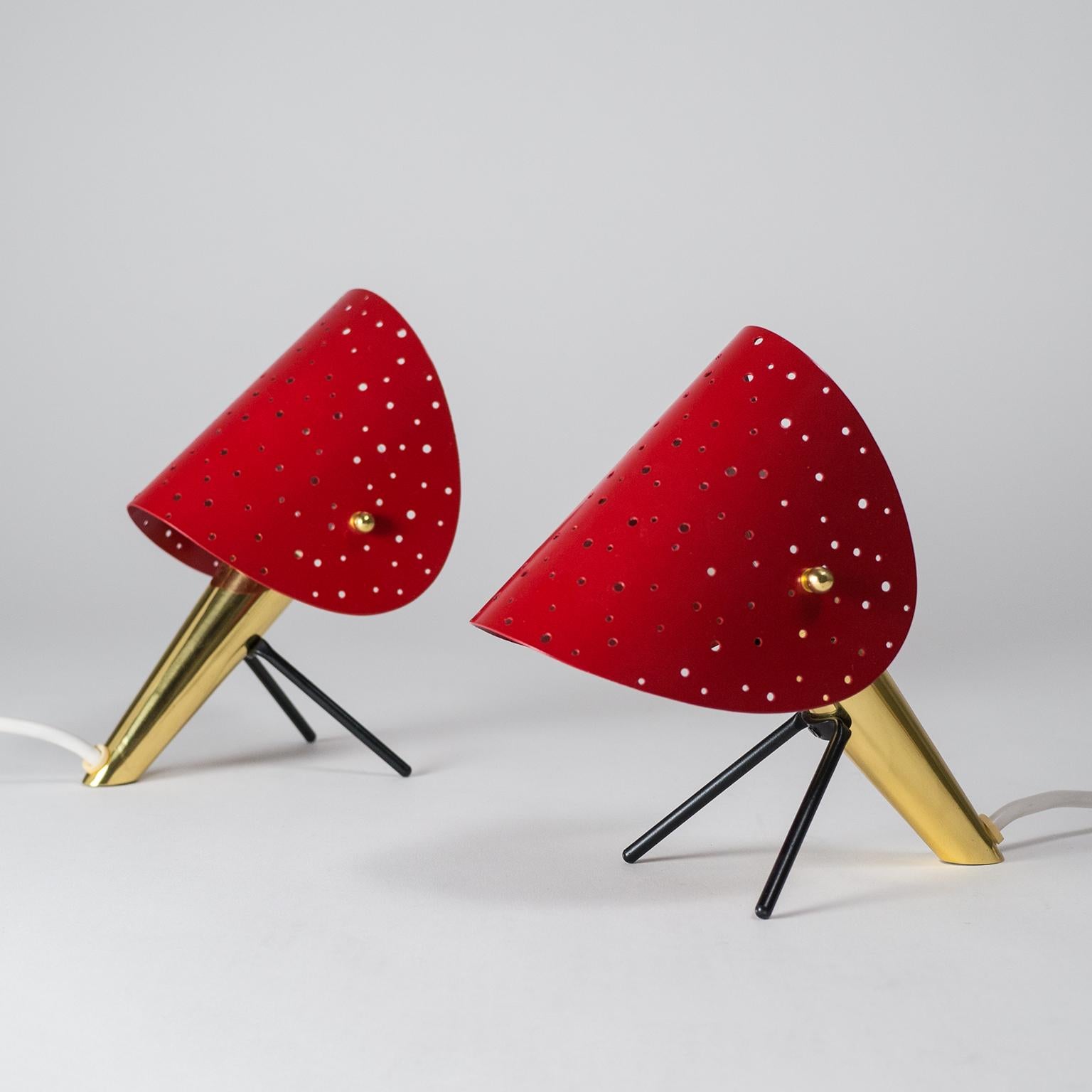 Lovely pair of Ernest Igl table lamps from the 1950s. Brass body with V-shaped lacquered metal legs and lacquered metal shades with pierced holes of varying size creating a magnificent light effect. Each lamp one original brass E14 socket.