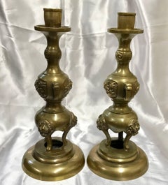 Pair of Brass Taper Candlesticks with Flowers and Griffins