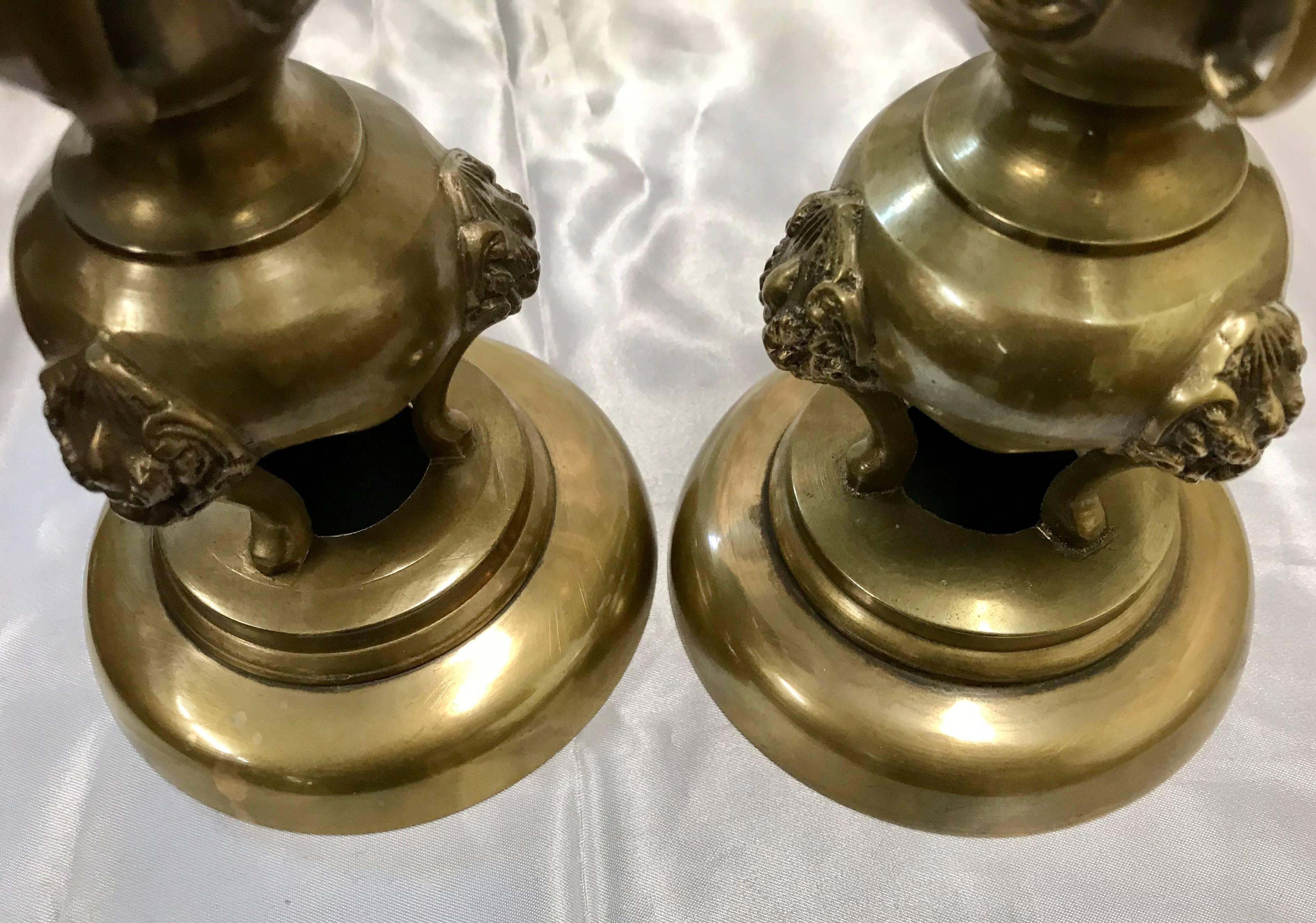 French Pair of Brass Taper Candlesticks with Flowers and Griffins For Sale