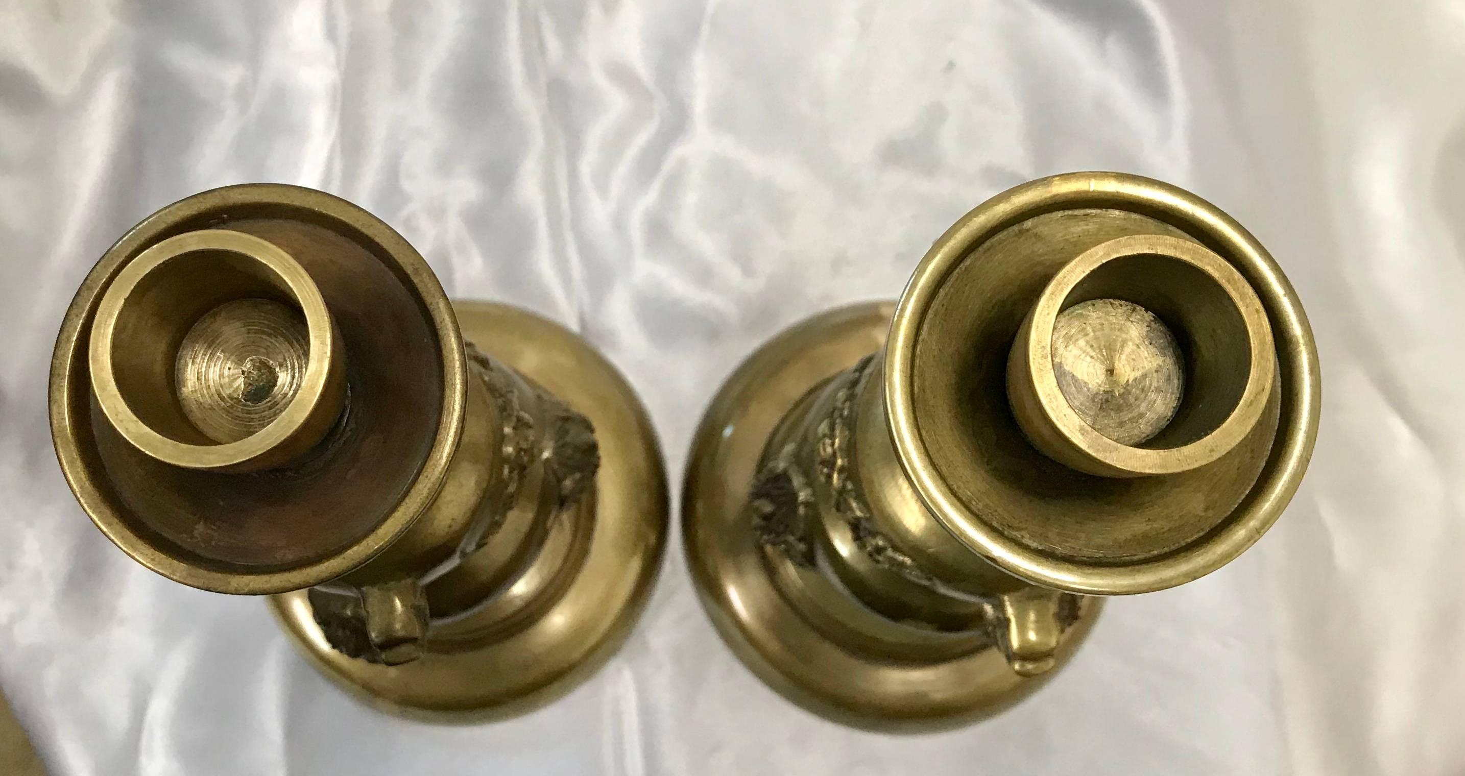 Cast Pair of Brass Taper Candlesticks with Flowers and Griffins For Sale