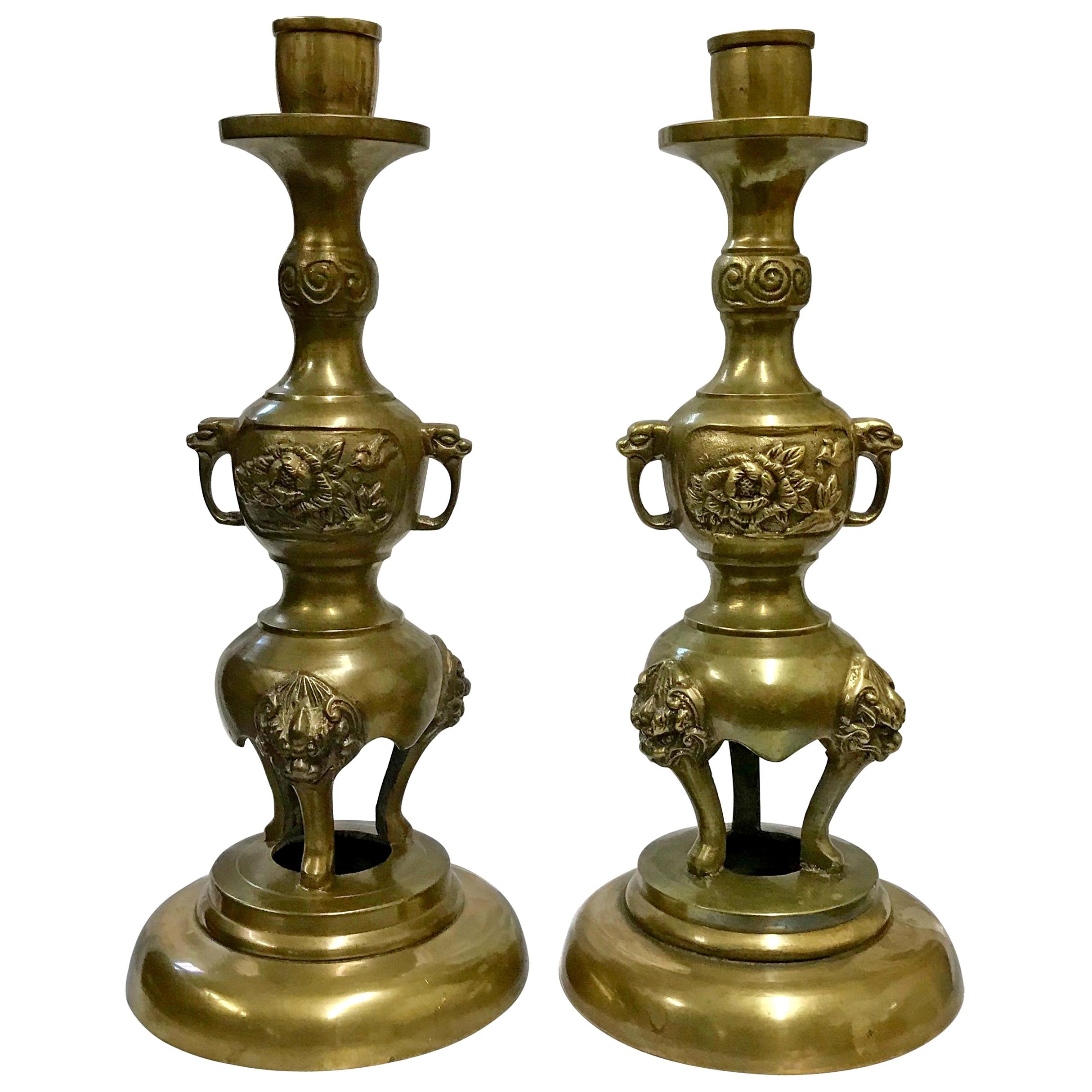 Pair of Brass Taper Candlesticks with Flowers and Griffins For Sale