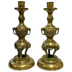 Pair of Brass Taper Candlesticks with Flowers and Griffins