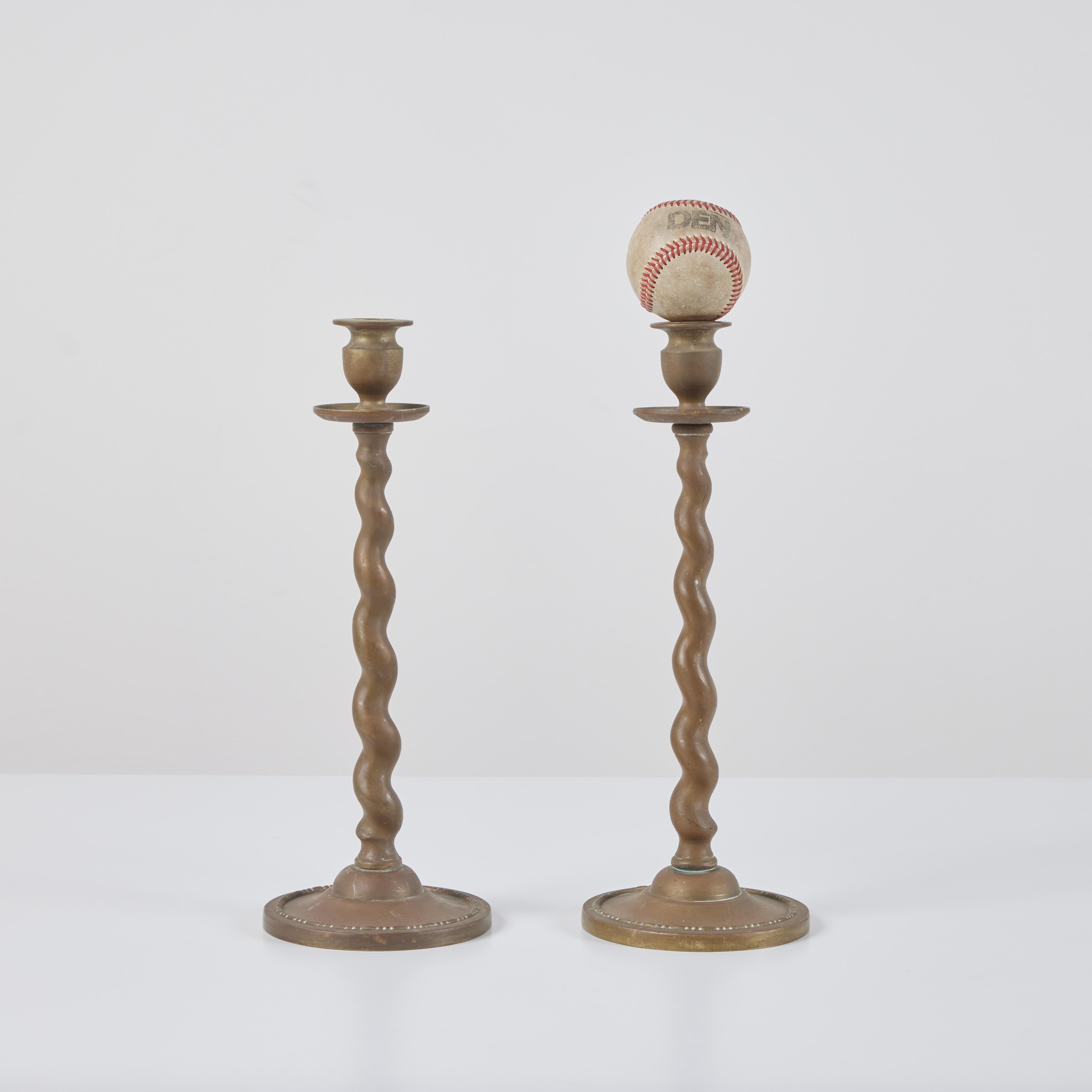 Mid-Century Modern Pair of Brass Twisted Candlesticks For Sale