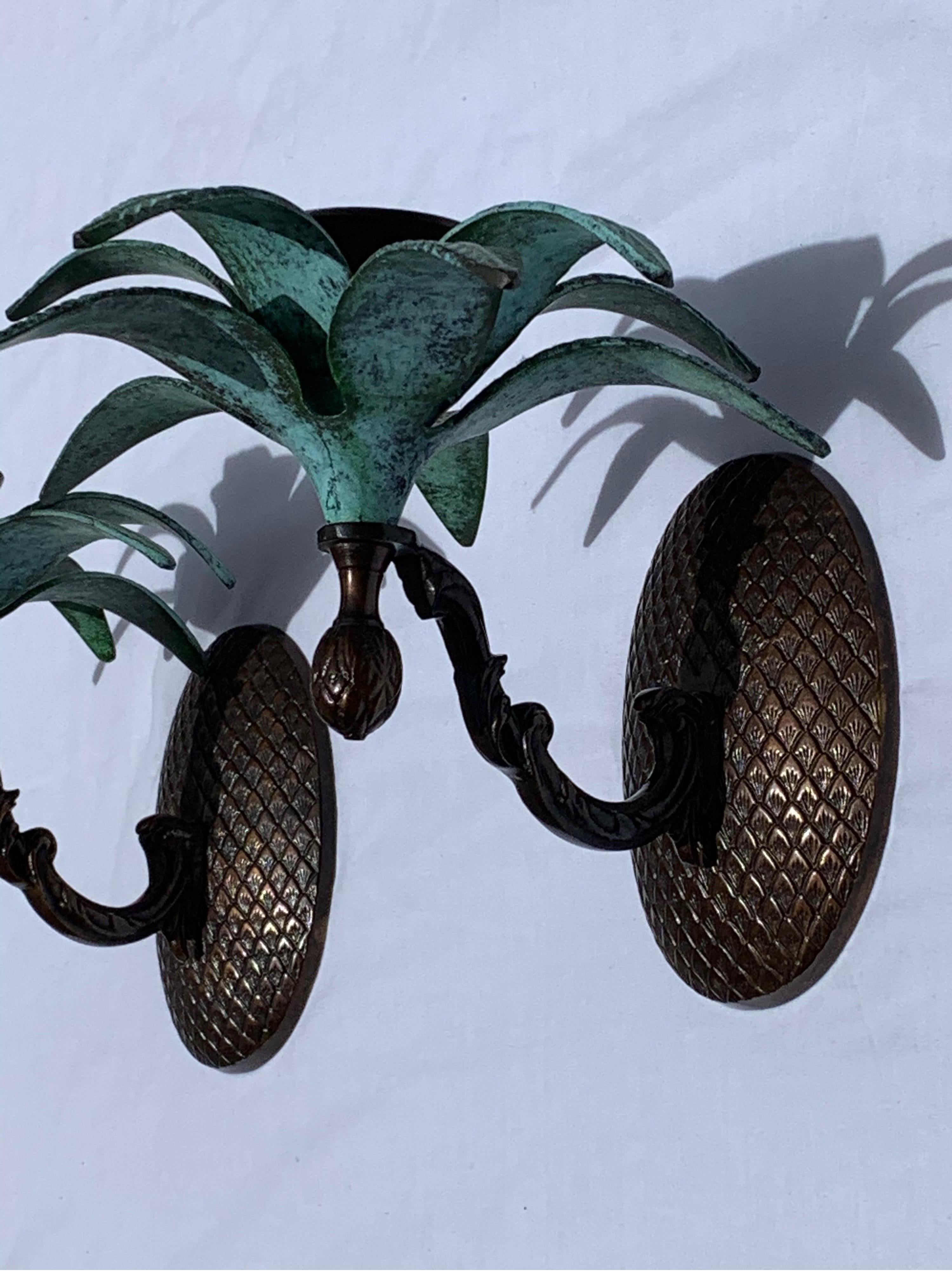 Elegant pair of wall candle sconces made of solid brass green pineapple leaves and very intricate backplate the sconces made for candleholder although very decorative and you could convert them to electrified sconces
The pair are sold only as