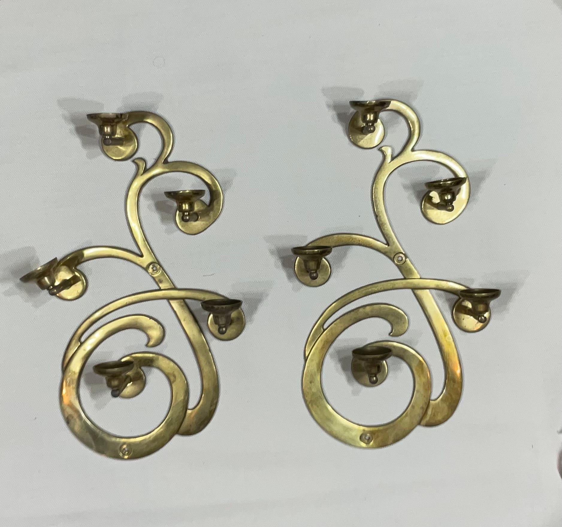 Beautiful pair of brass wall hanging candle holder.