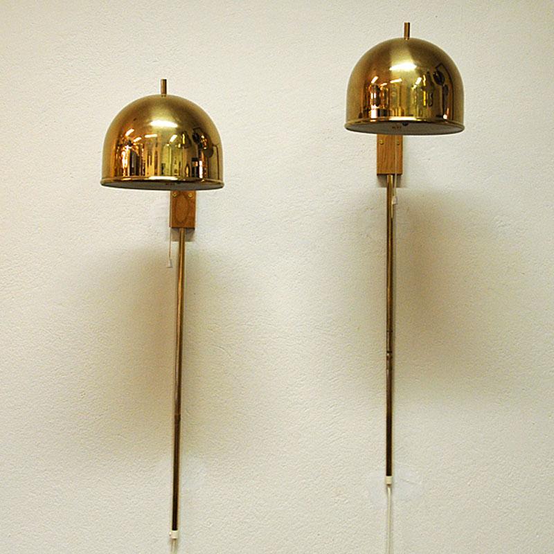 Pair of stylish and decorative brass wall lamps model G-075. Designed and made in Sweden by Bergboms in the early 1960s.
Both lamps are fully working and in good vintage condition. Round shaped brass shades painted white on the inside. Material: