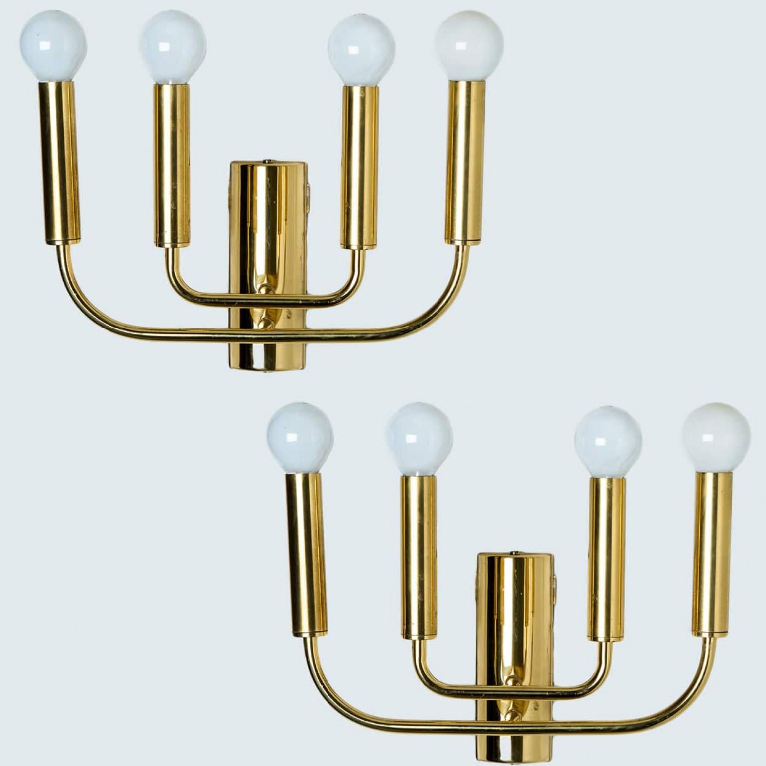 Pair of  high quality brass wall lights in the style of Florian Schulz. Solid brass in a glossy finish.

The stylish and clean elegance of this lamp suits many environment, from mid century to Hollywood Regency, from Danish modern to Space Age and